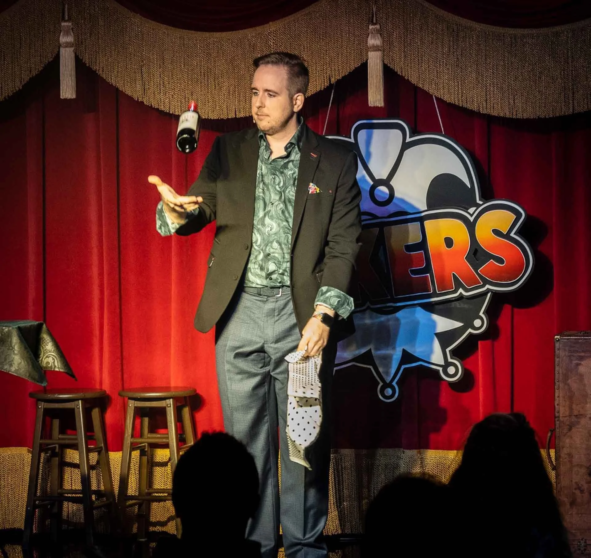 James Alan with a floating wine bottle at Jokers Comedy Club in Richmond Hill