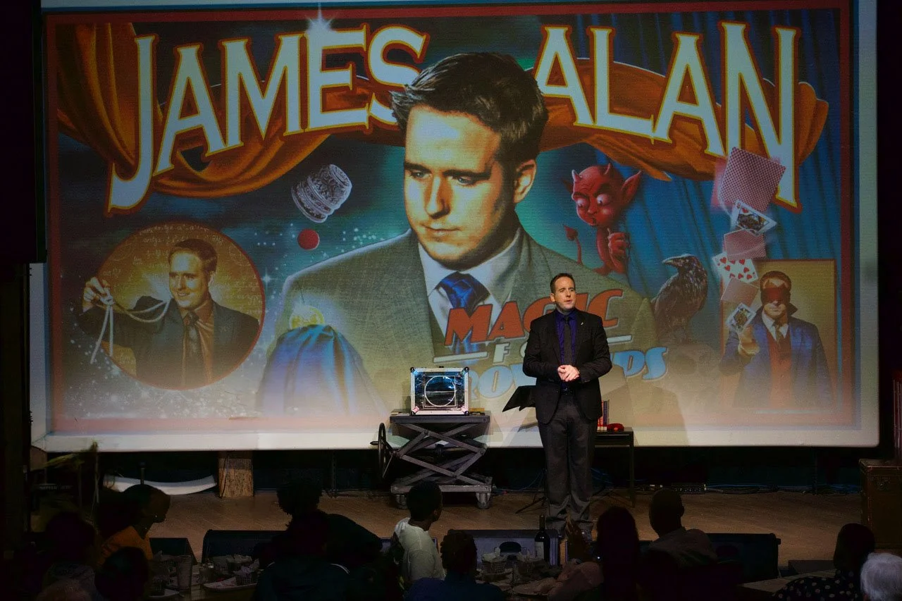 James Alan does magic on stage at the Rec Room in Toronto