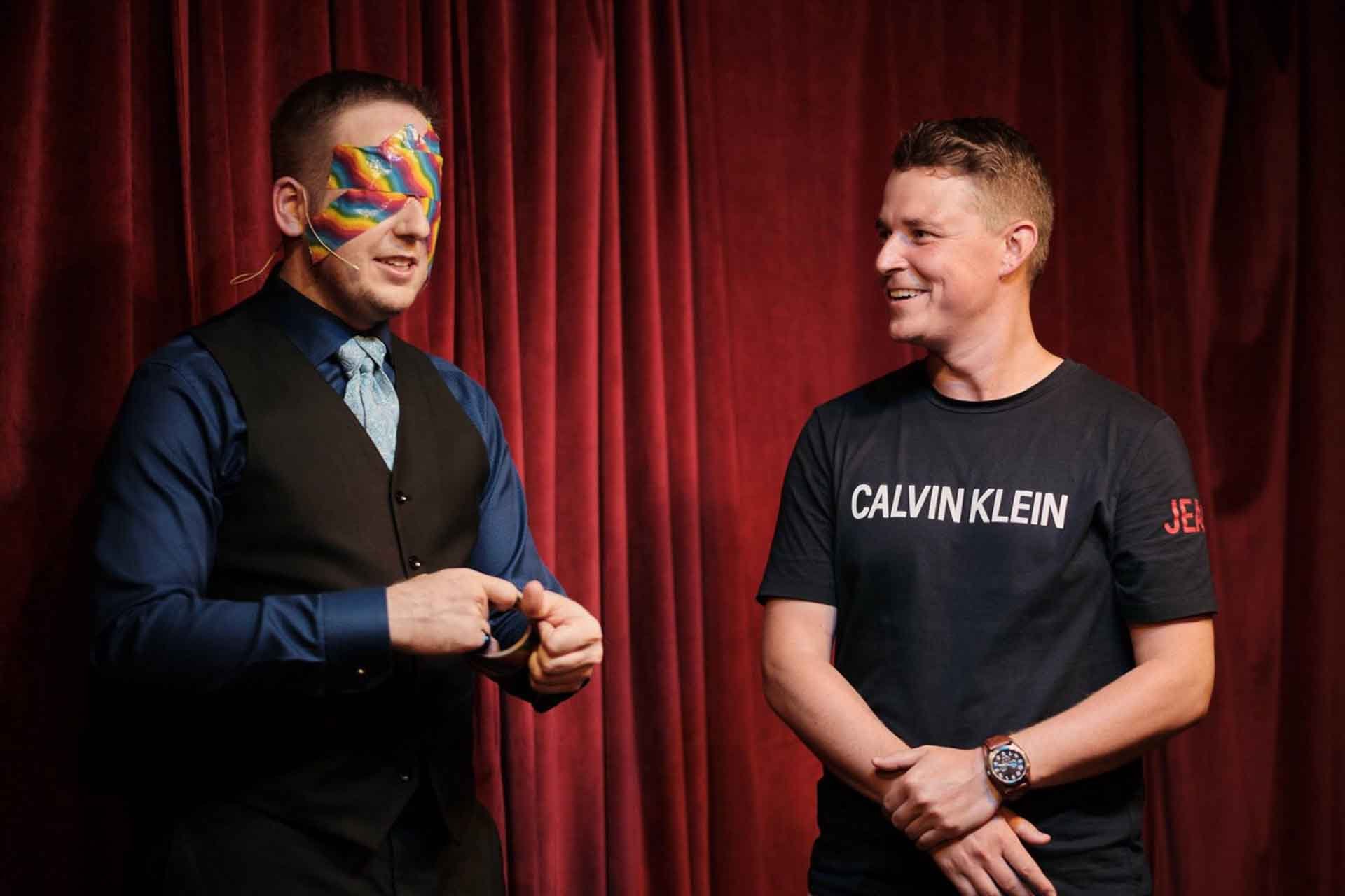 James Alan blindfolded with rainbow duct tape for pride at See Scape in Toronto