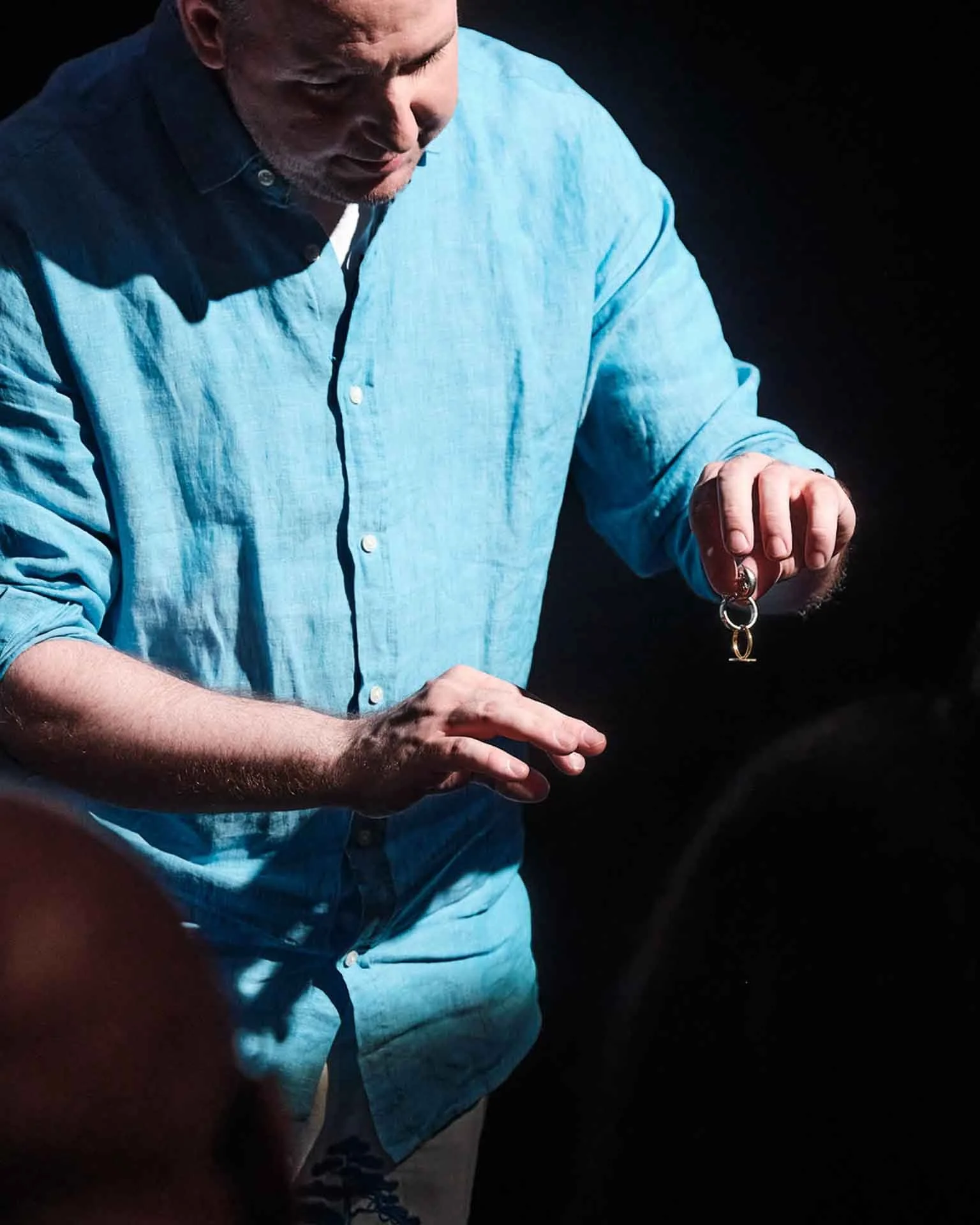 James Alan links finger rings at the Toronto Fringe Festival
