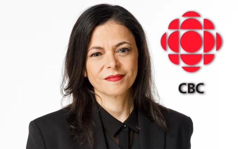 woman with dark hair and a black shirt and jacket with CBC Logo