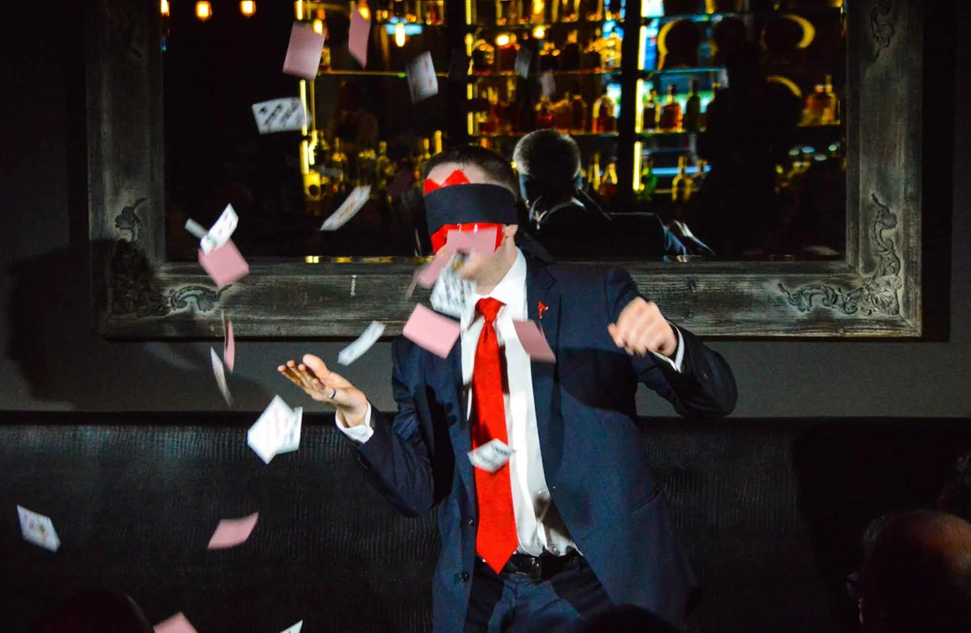 James Alan blindfolded with a shower of cards Canada Day Spirit House Toronto