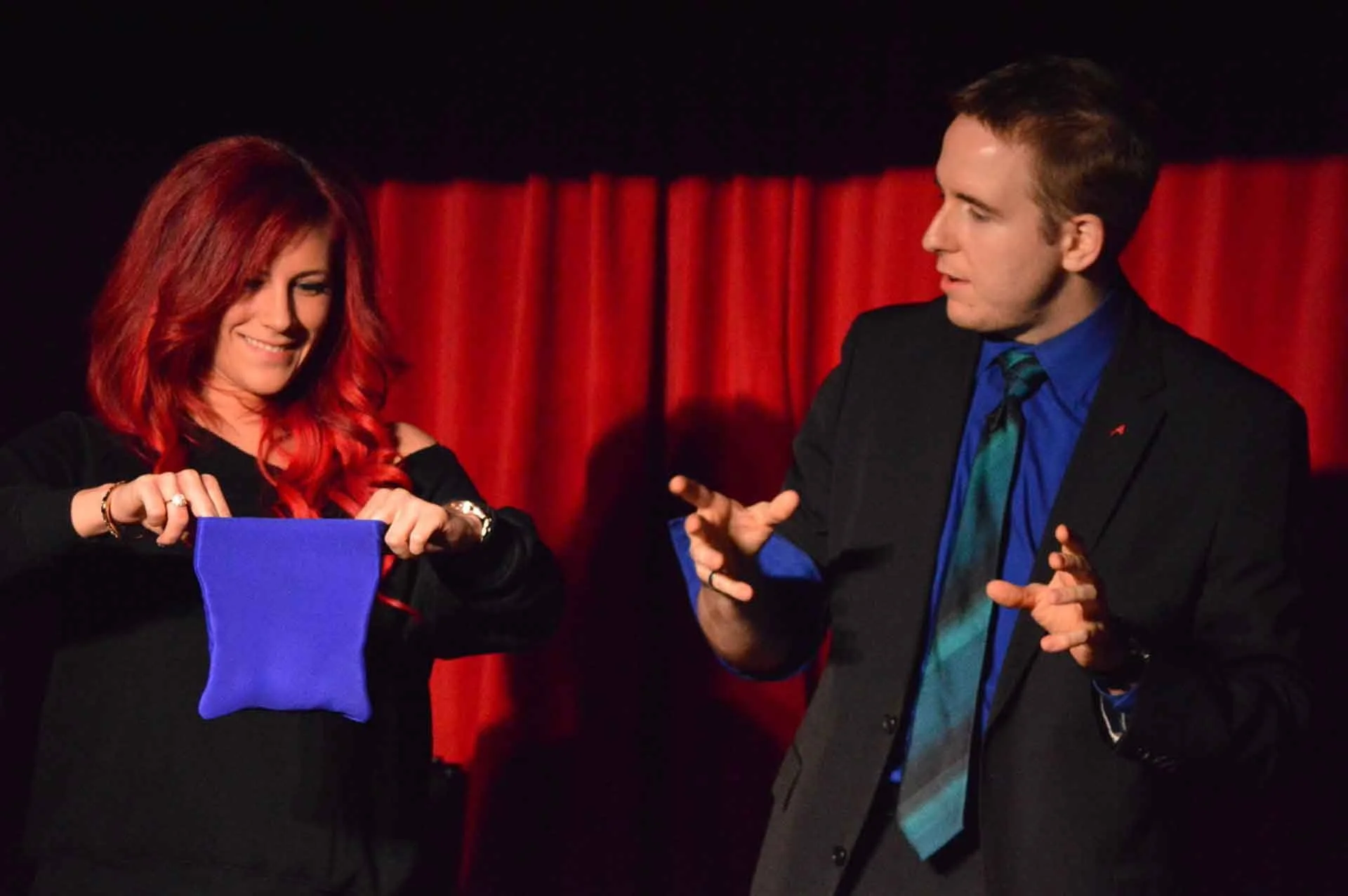 James Alan performing on stage with woman with red hair at the Crimson Lounge in Toronto