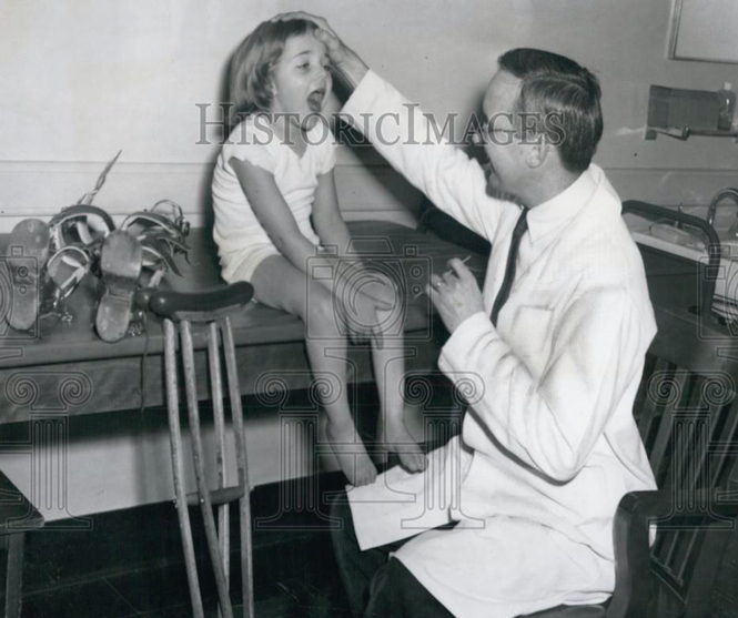 whoriskey's father, Dr. Frederick Whoriskey, with a Patient at Kennedy Memorial Hospital (1959 press photo)