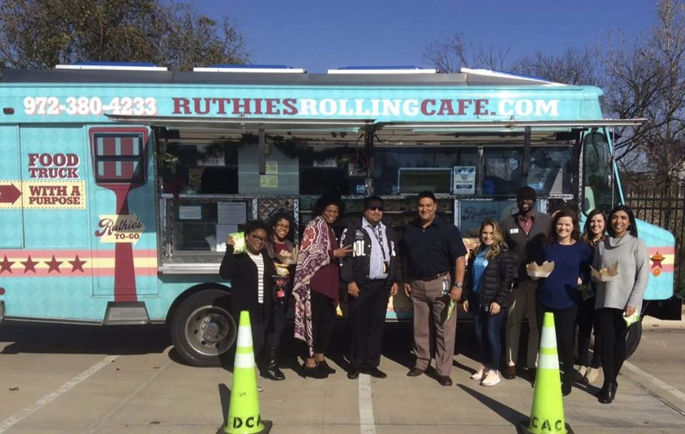 The staff of DCAC enjoying lunch from Ruthie’s Rolling Cafe!
