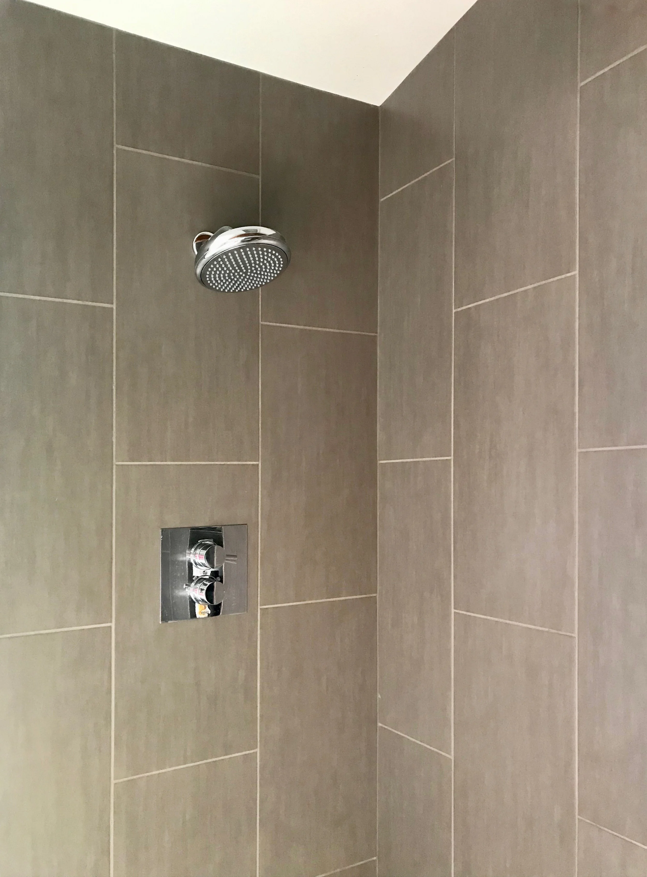 Vertical 12" x 24" tile on a vaulted shower ceiling