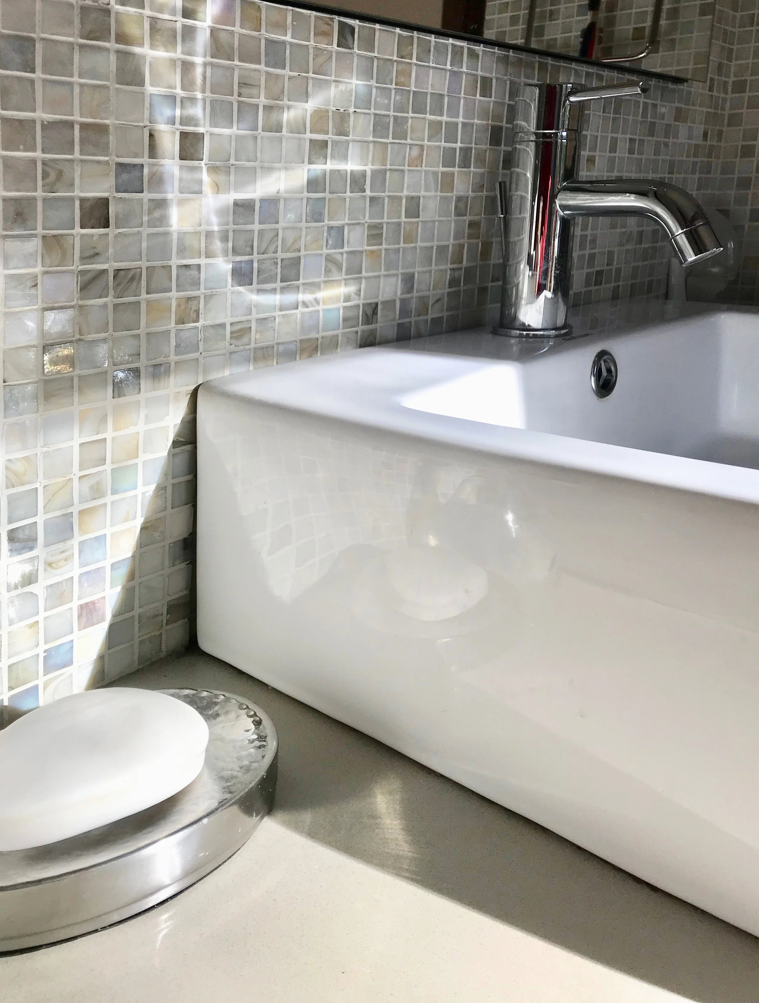 Reflections of this Iridescent tile and vessel sink