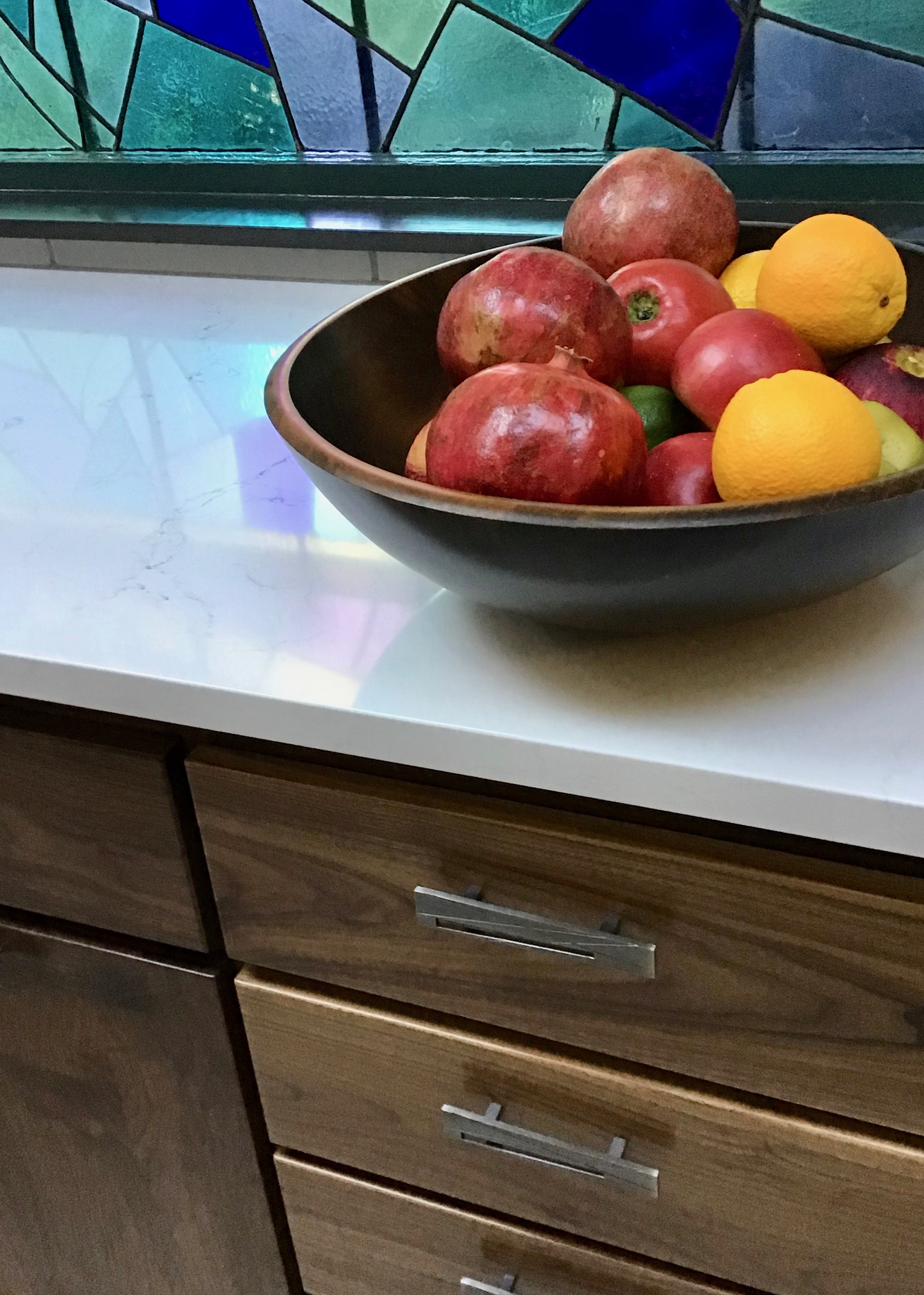 Close up of walnut cabinets / misterio quartz counters