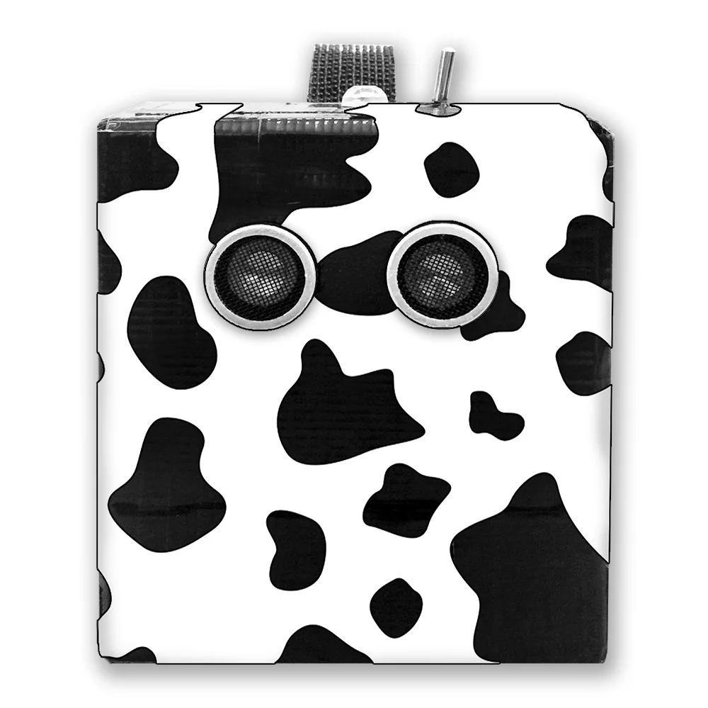 Inspired by a cow finger glove Will was playing with during the interview, we decided to wrap Arnold in a cow spots pattern.