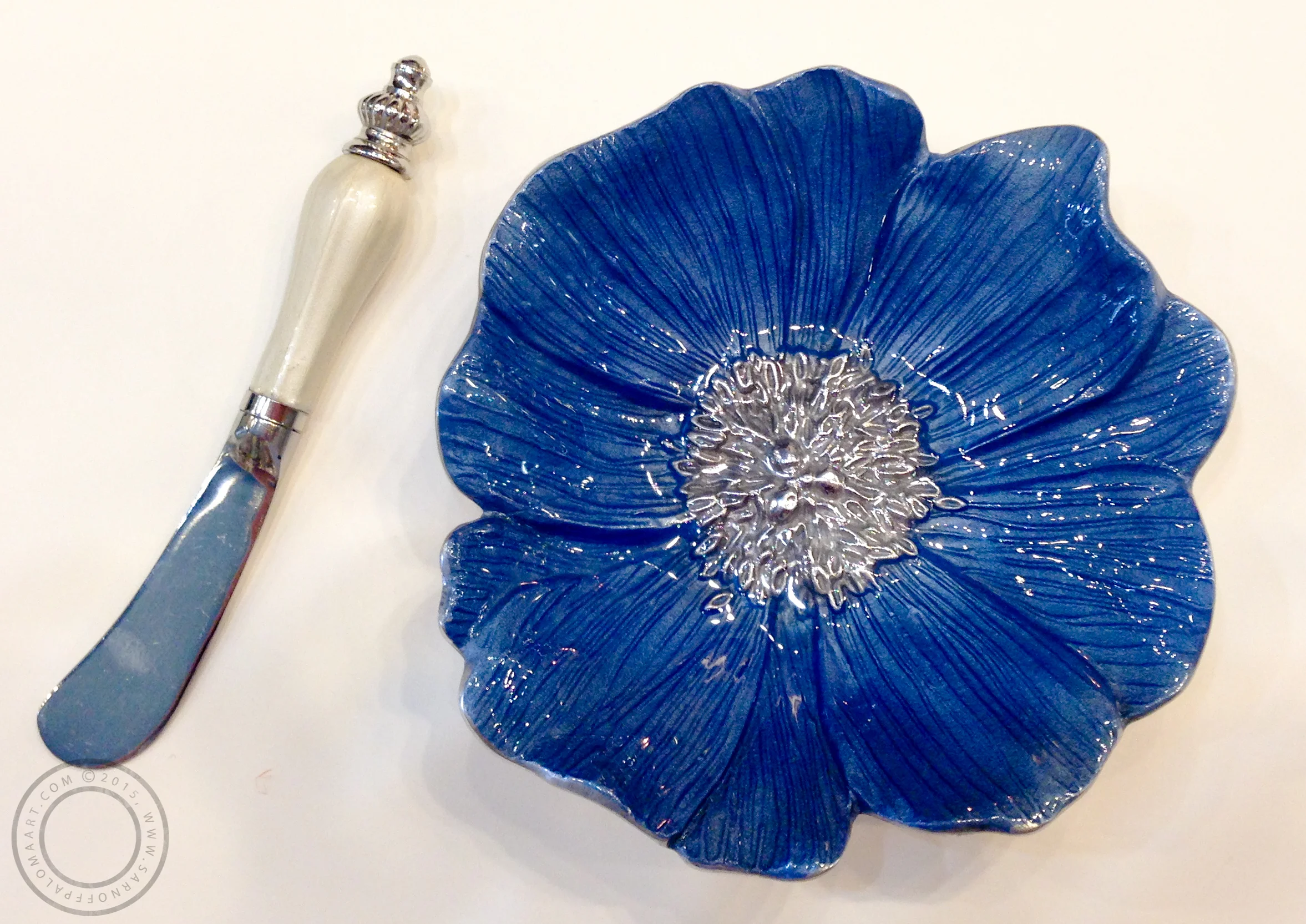 Mariposa flower dish-$44, Knife-$20