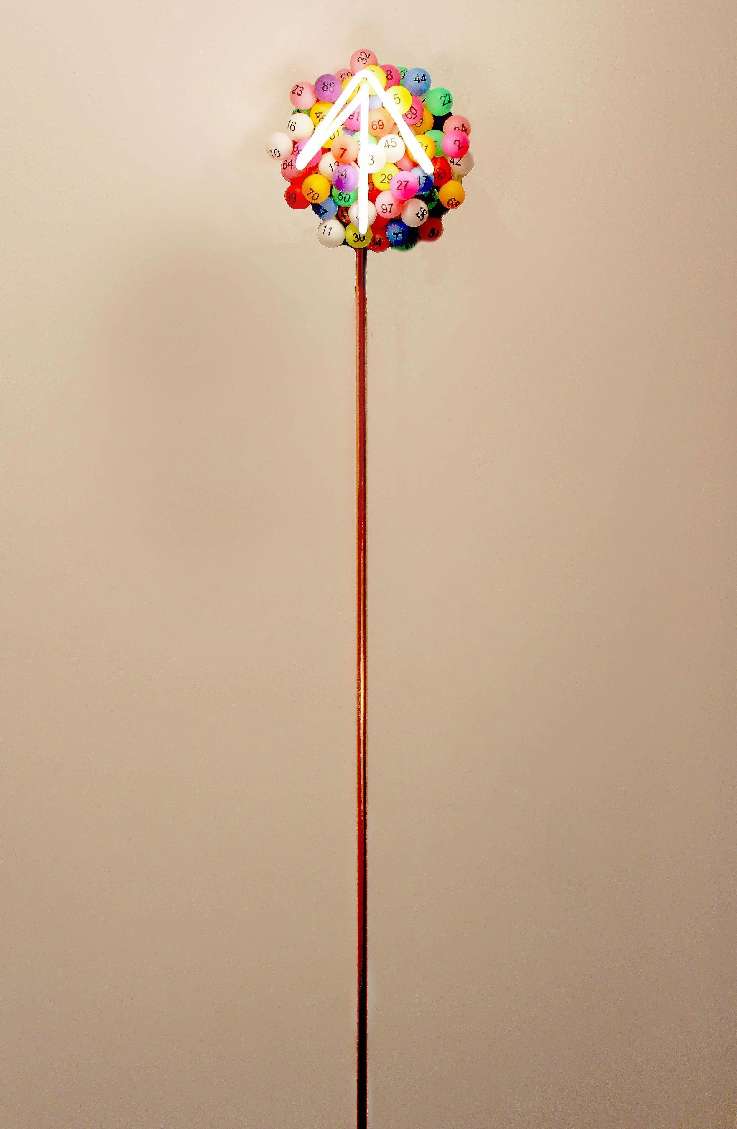 Chance, 2016. Neon, lottery balls, and copper. 10 x 10 x 4 inches. Top fixture has a 10" diameter and the entire piece is 6' tall. Hangs from wall.