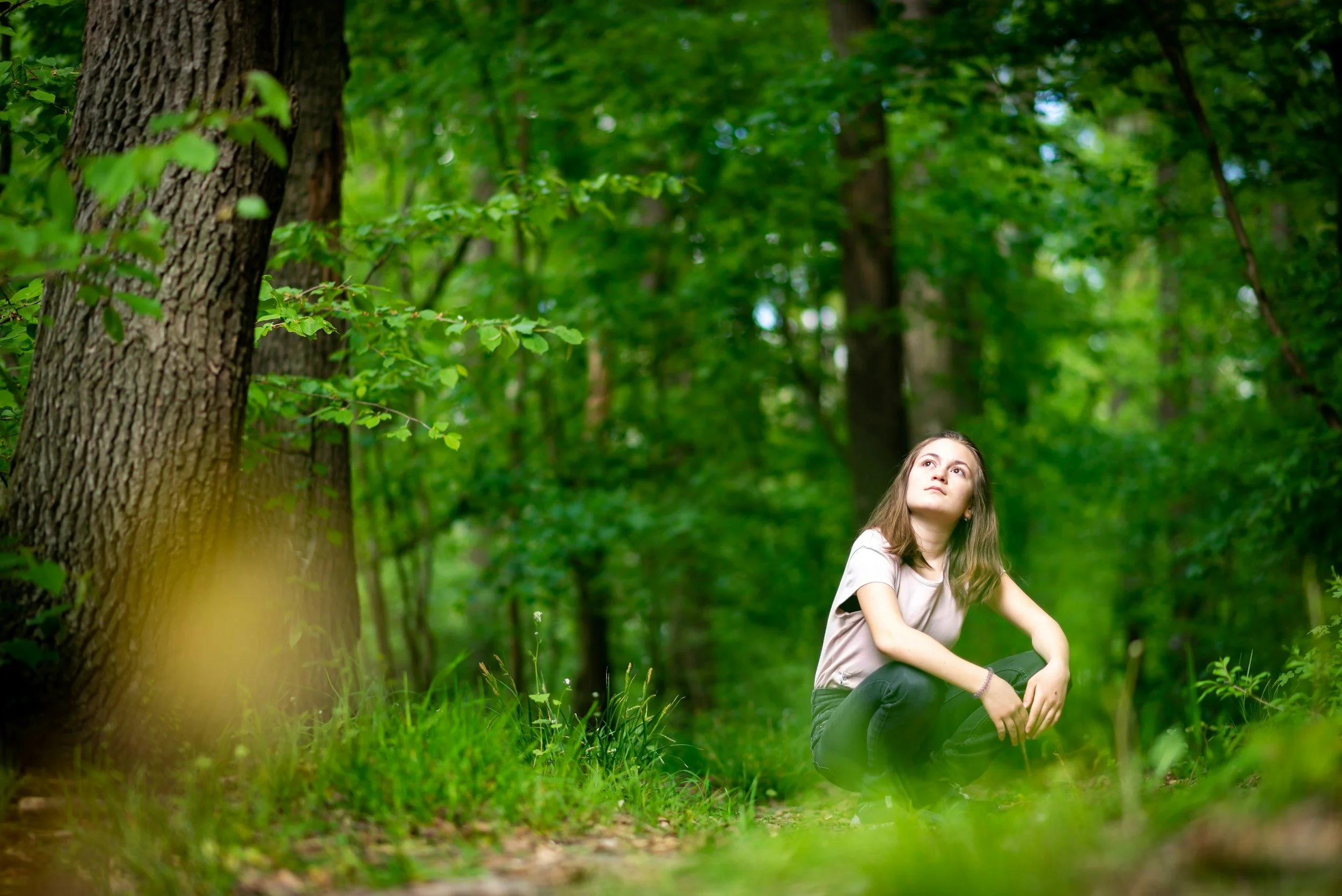 kid pondering in forest