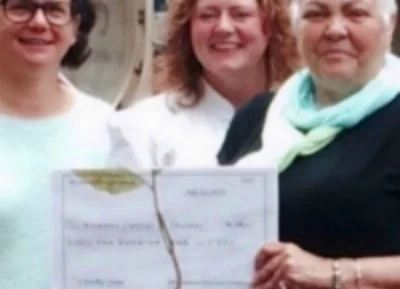 Kim Patterson and Brandi Phillips present, President and CEO, Shirl Regan $6,200!
