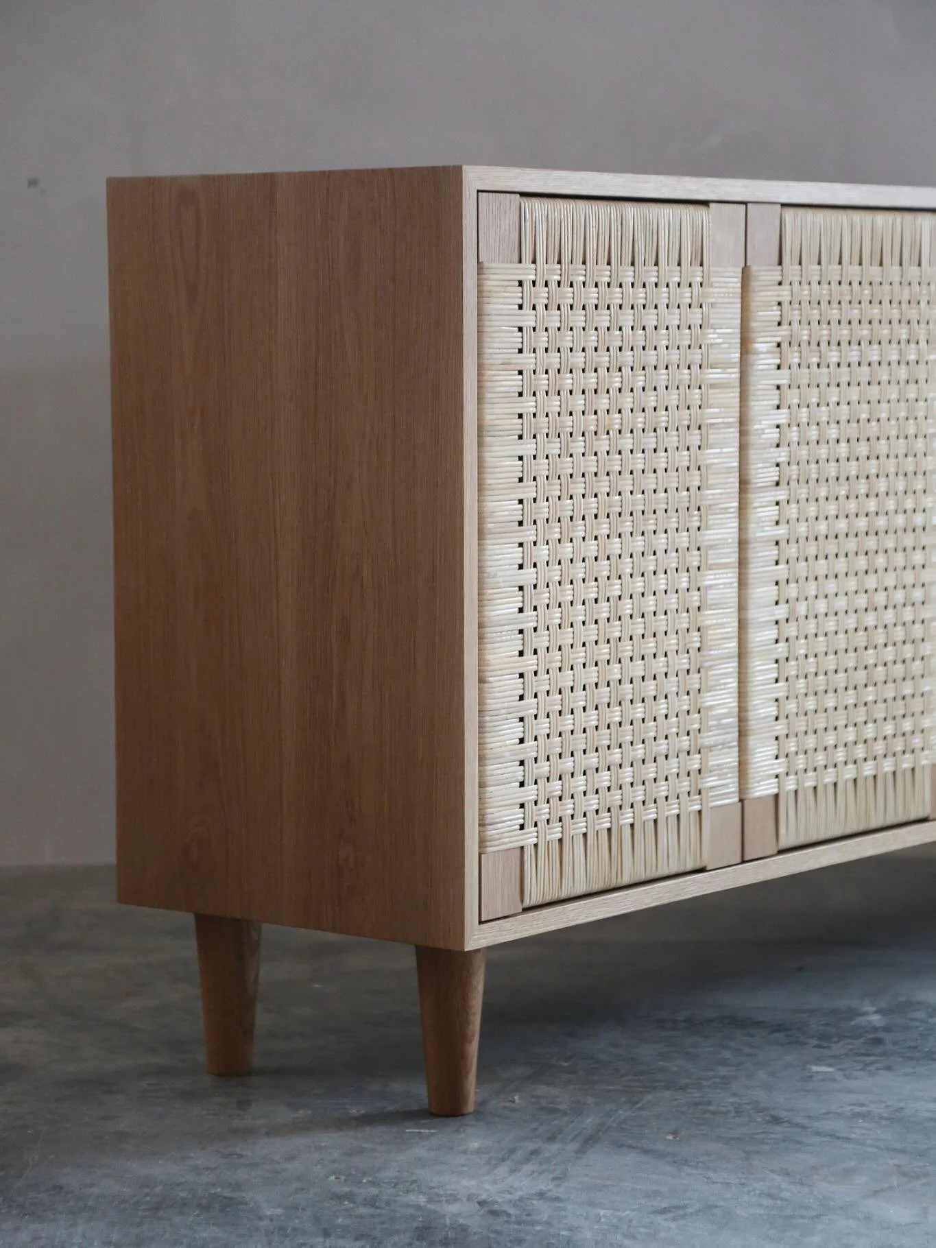 A few of the Eileen cabinets that have left the shop recently. Solid wood and binder cane. Hand woven in house and made to order, as always. She looks good from the back, too.