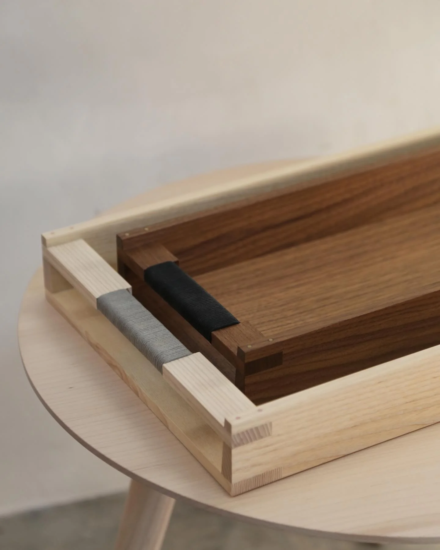 rectangle trays are in stock! for coziness and organization 

we have a batch available in pale ash, blackened ash, and walnut in two different sizes. hand built of solid wood, with copper pinned joinery and wrapped cotton cord handles