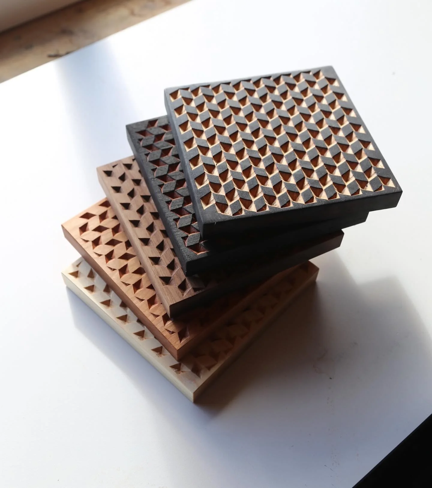 herringbone trivet restock! we made a batch in cherry, walnut, maple and blackened shou sugi ban - ready for your winter table ❄️