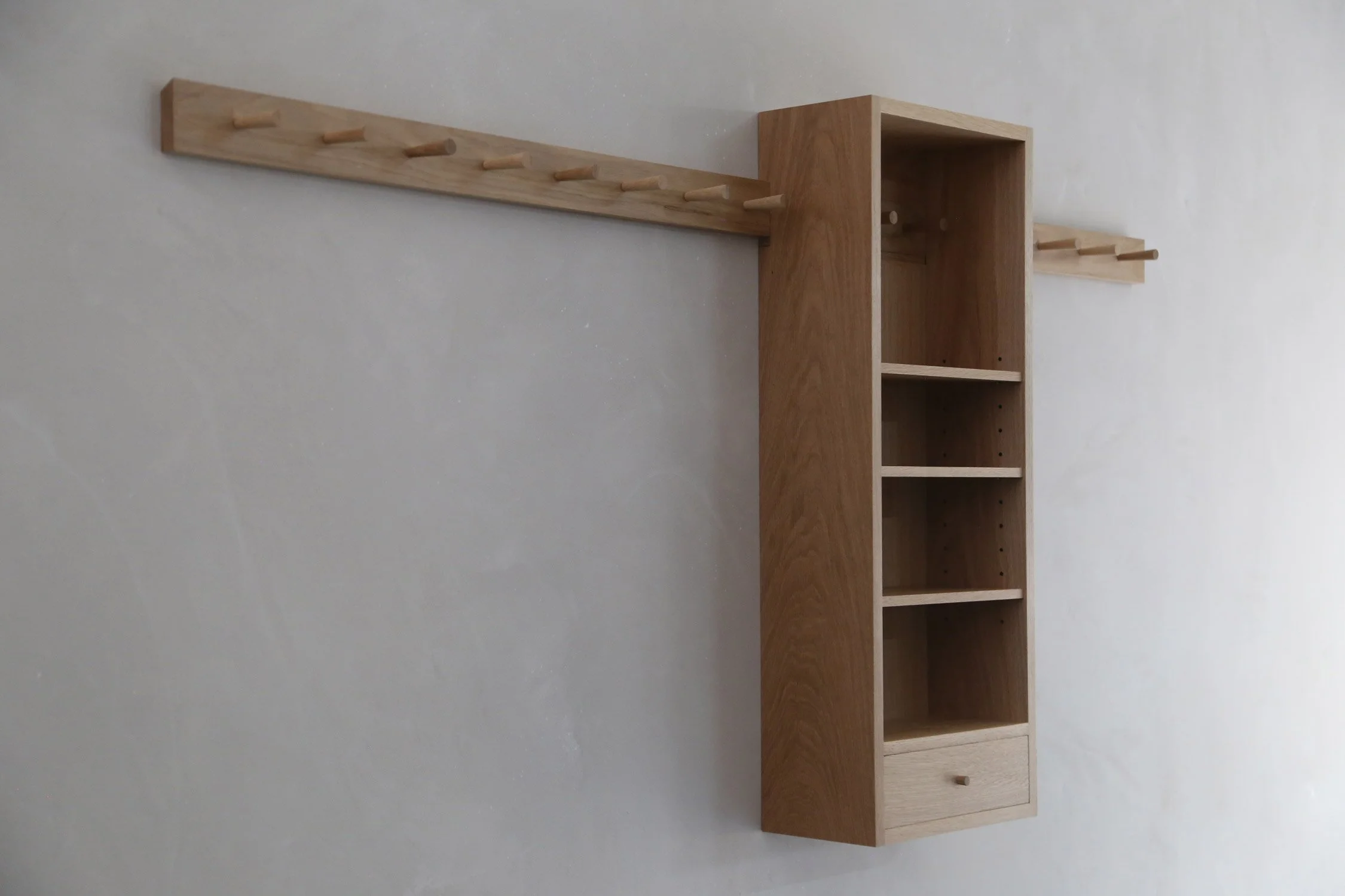   INQUIRE   The Simple Peg Cabinet is the cousin of our Splint Peg Cabinet. This cabinet features simpler construction techniques and design details than the original, but offers the same heirloom level quality. A stunning addition to an entryway or 
