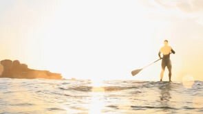 Australian chef, Tom Walton enjoying his day off on a stand up paddle board.