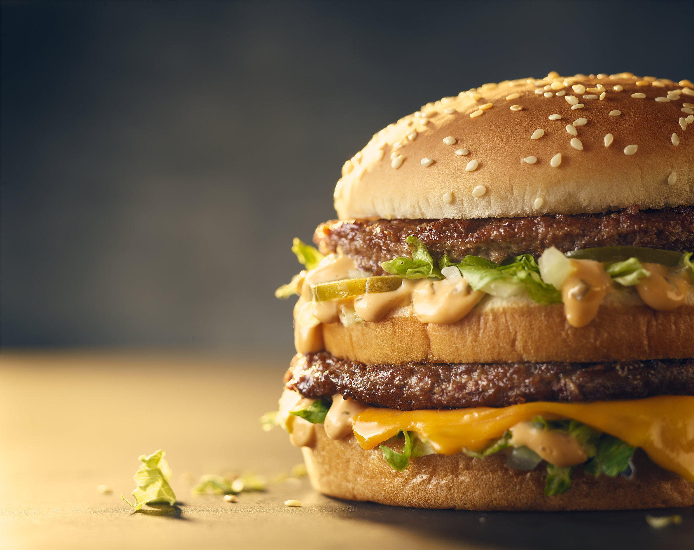 A close up of a McDonald's Big Mac in soft lighting