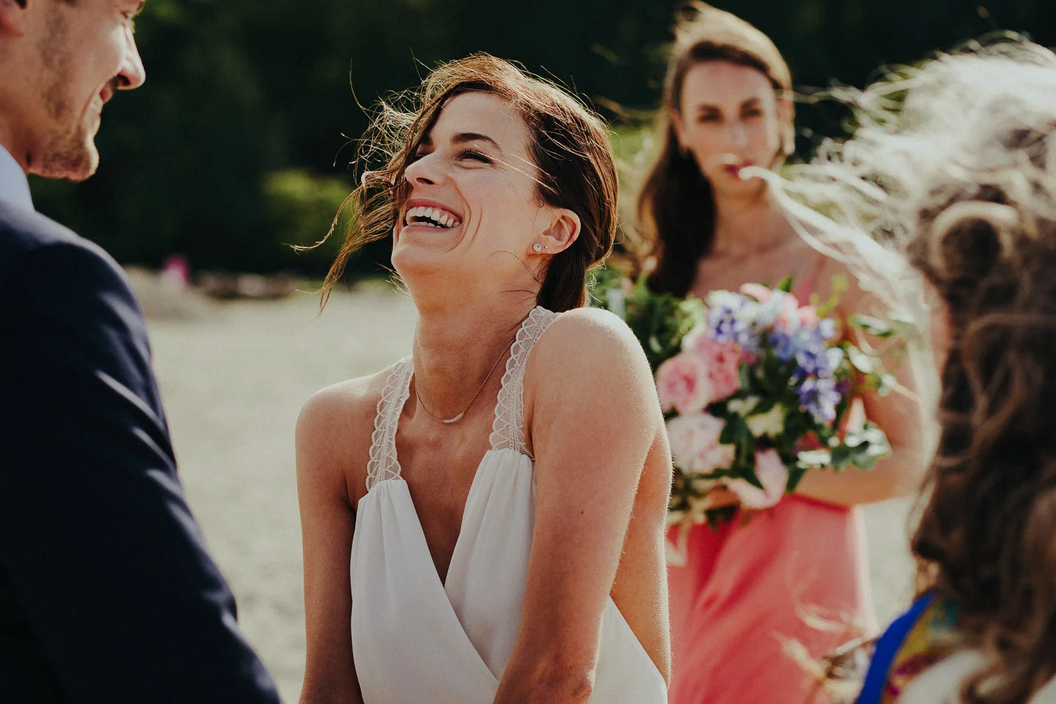 laughing bride during the beach ceremony