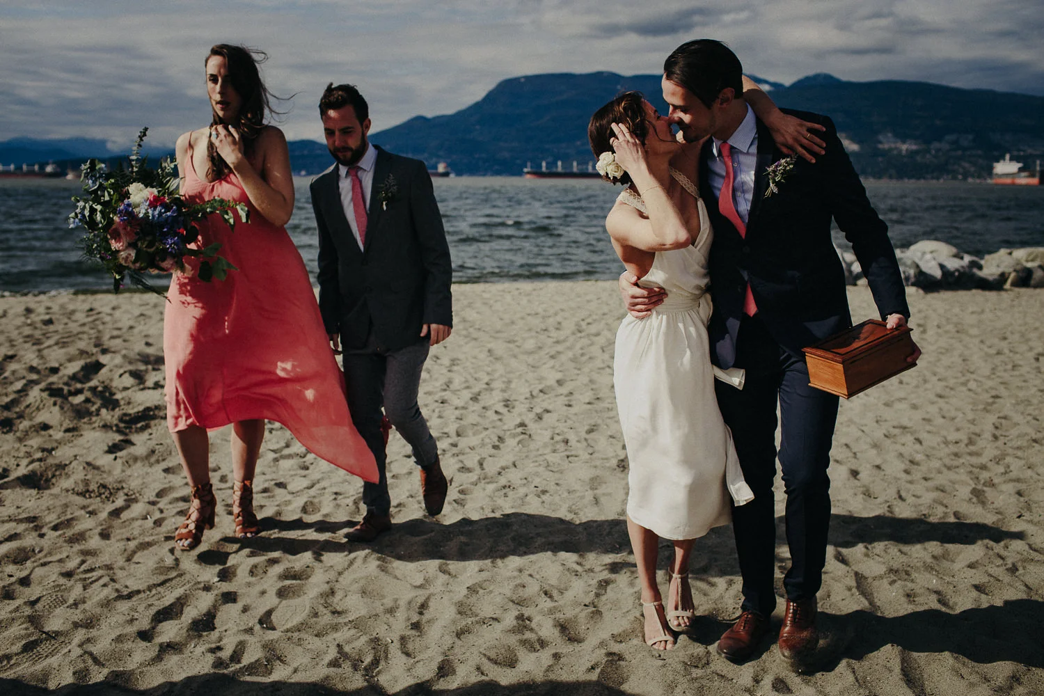 kissing bride and groom on the beach
