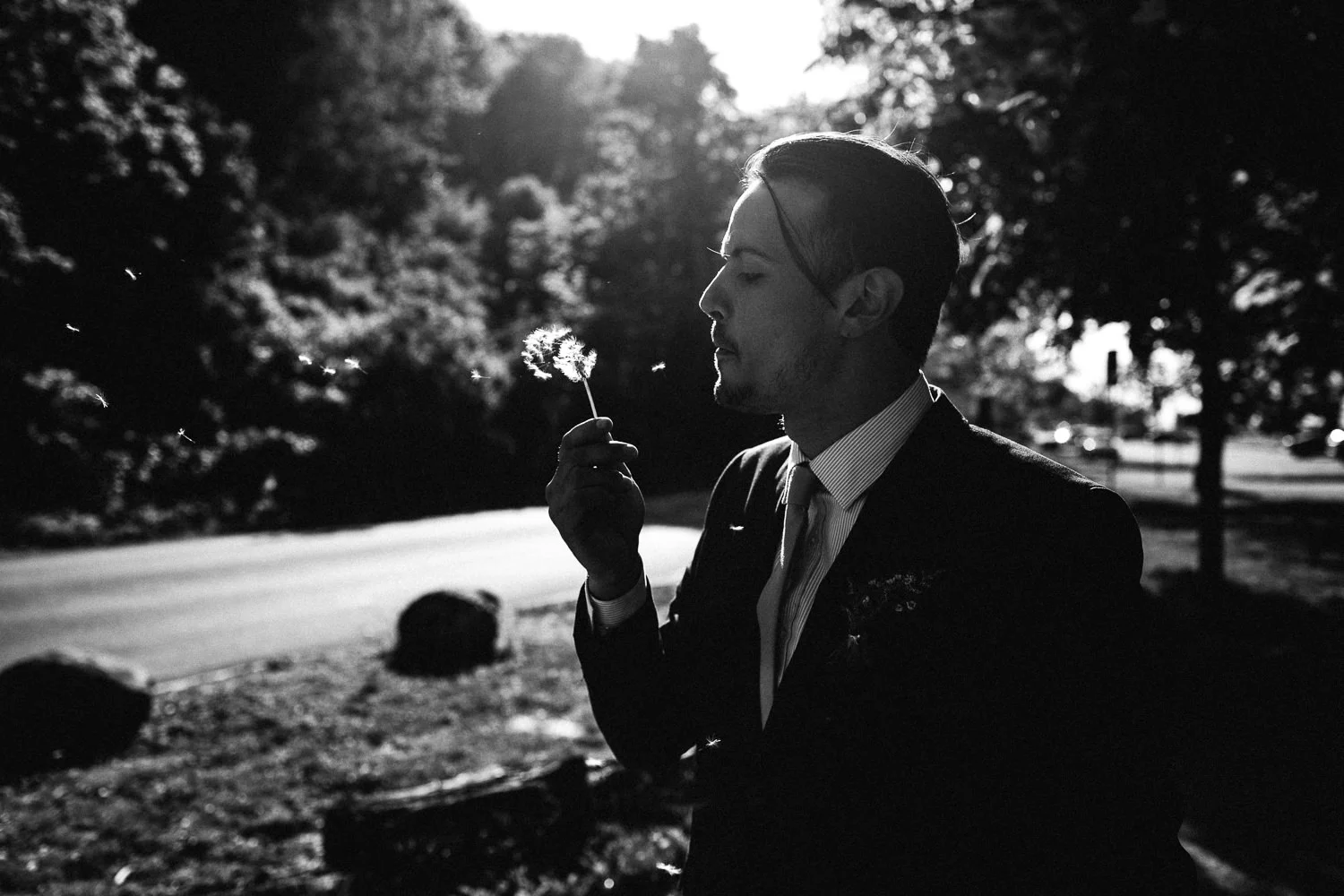 groom with a dandelion