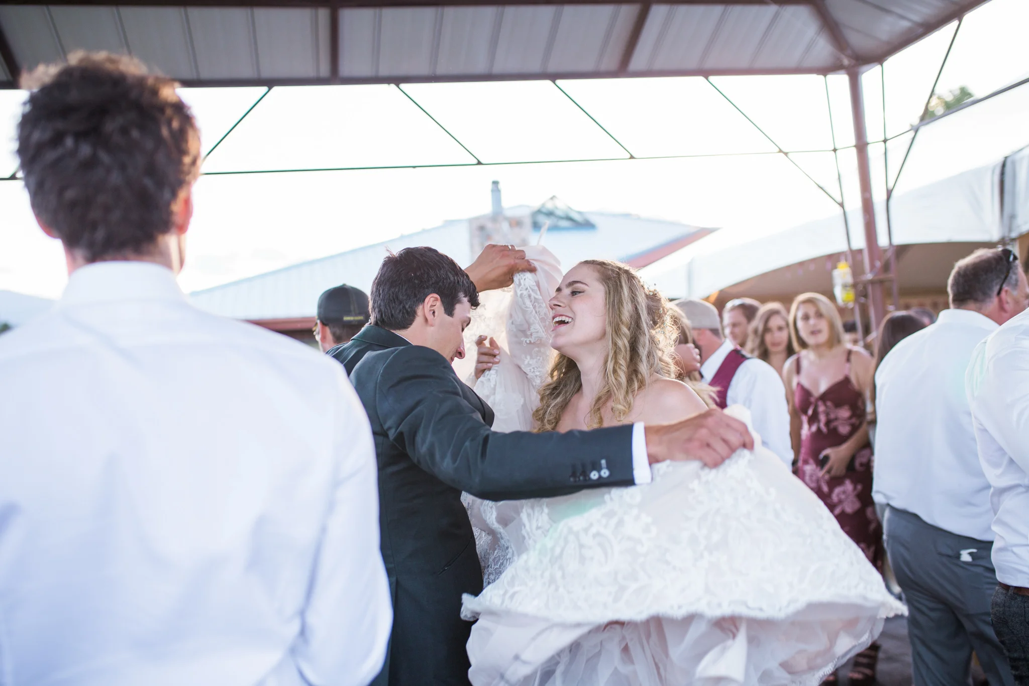 If you have a train, usually I'd say make sure you have a good bustle, but apparently, your new husband can also help keep your dress out of the way when it's dance floor time!