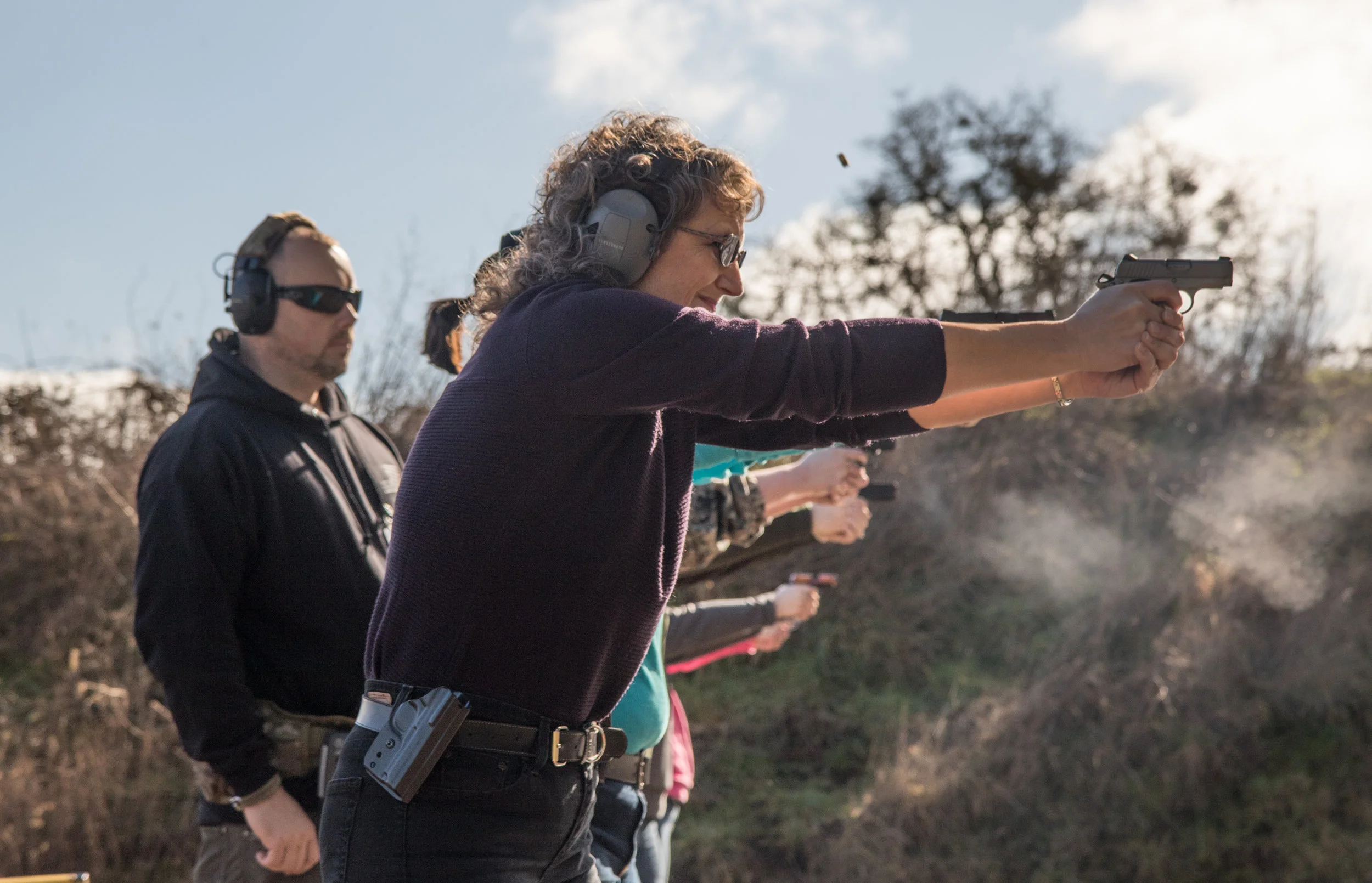 Karen Wussting fires down range during one of LeBlanc's women's self-defense classes at the Albany Rifle and Pistol Club on Feb. 11, 2017. Though she has held her concealed carry permit in Oregon for multiple years, she has never actively carried firearms. "I'm hoping to build my confidence with the gun so that I will feel more comfortable keeping it on me more often," Wussting said. (Aaron Nelson)