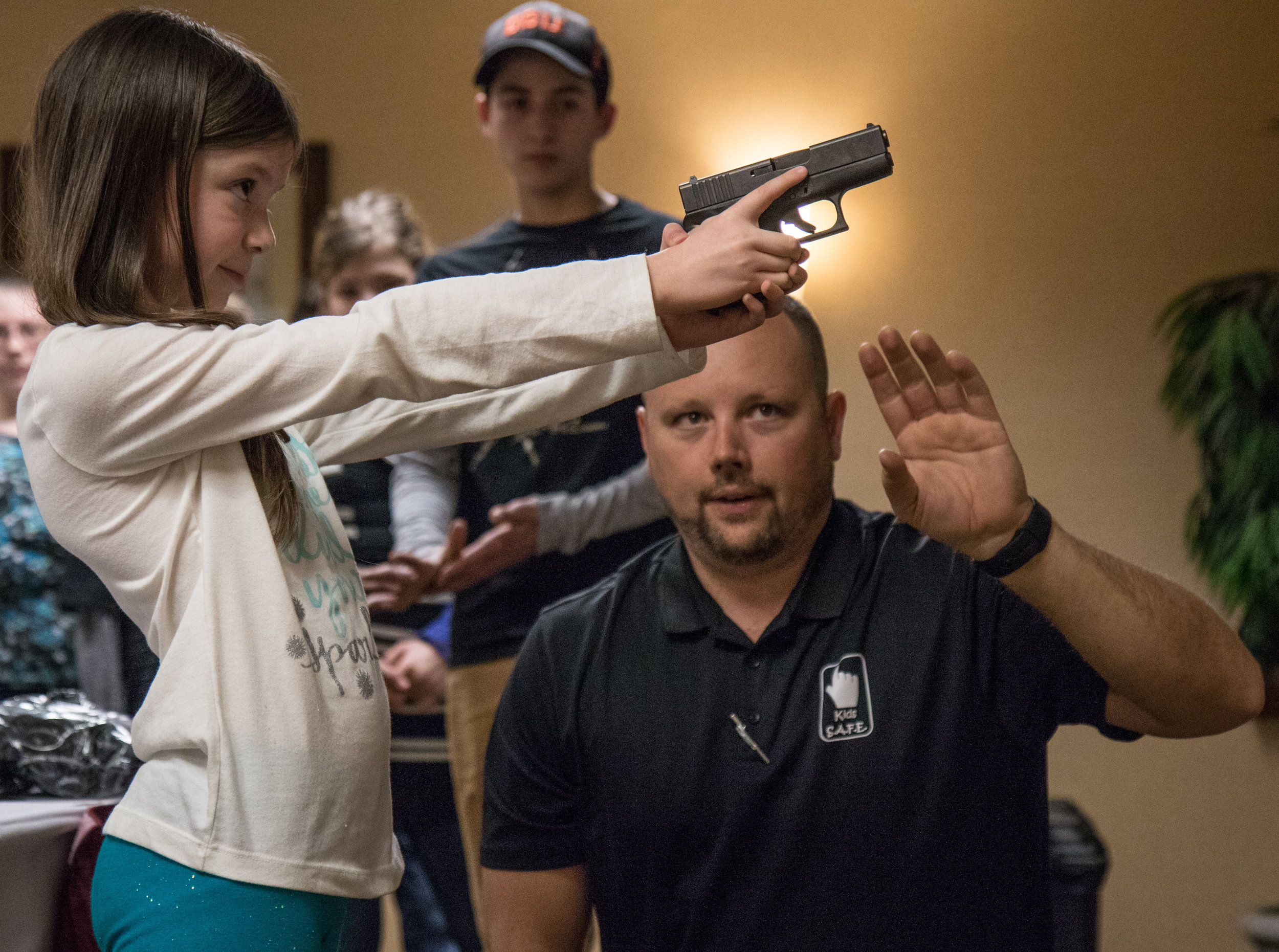  LeBlanc observes a child handling a Glock handgun during a Kids S.A.F.E. course in Springfield, Ore., on Jan. 22, 2017, looking to ensure she keeps her finger off of the trigger, and the muzzle pointed in a direction away from anyone who would be ha
