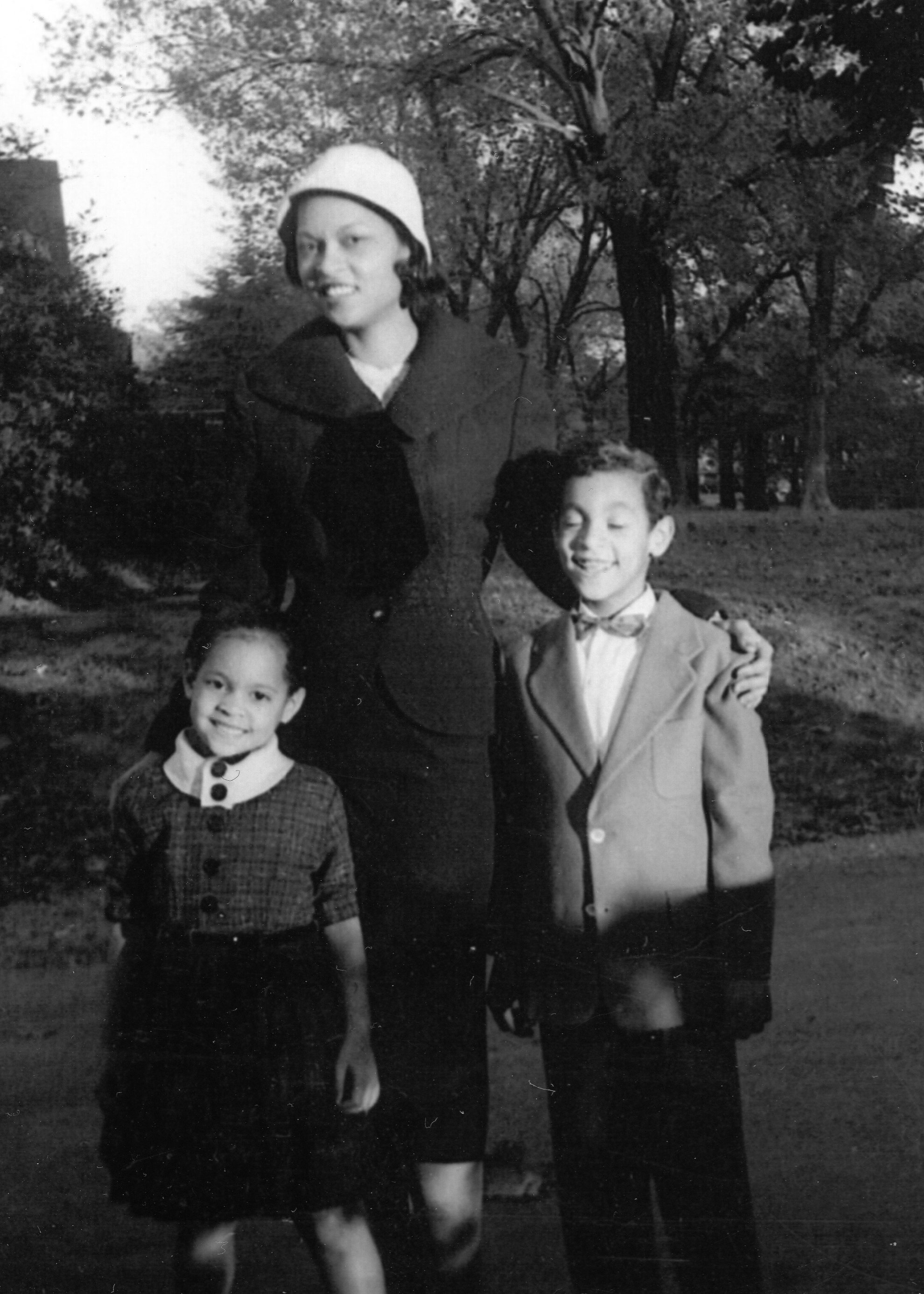 Left to right: Erica's mother, grandmother, and uncle in the front yard of their home on Parkway, circa mid-1950's.