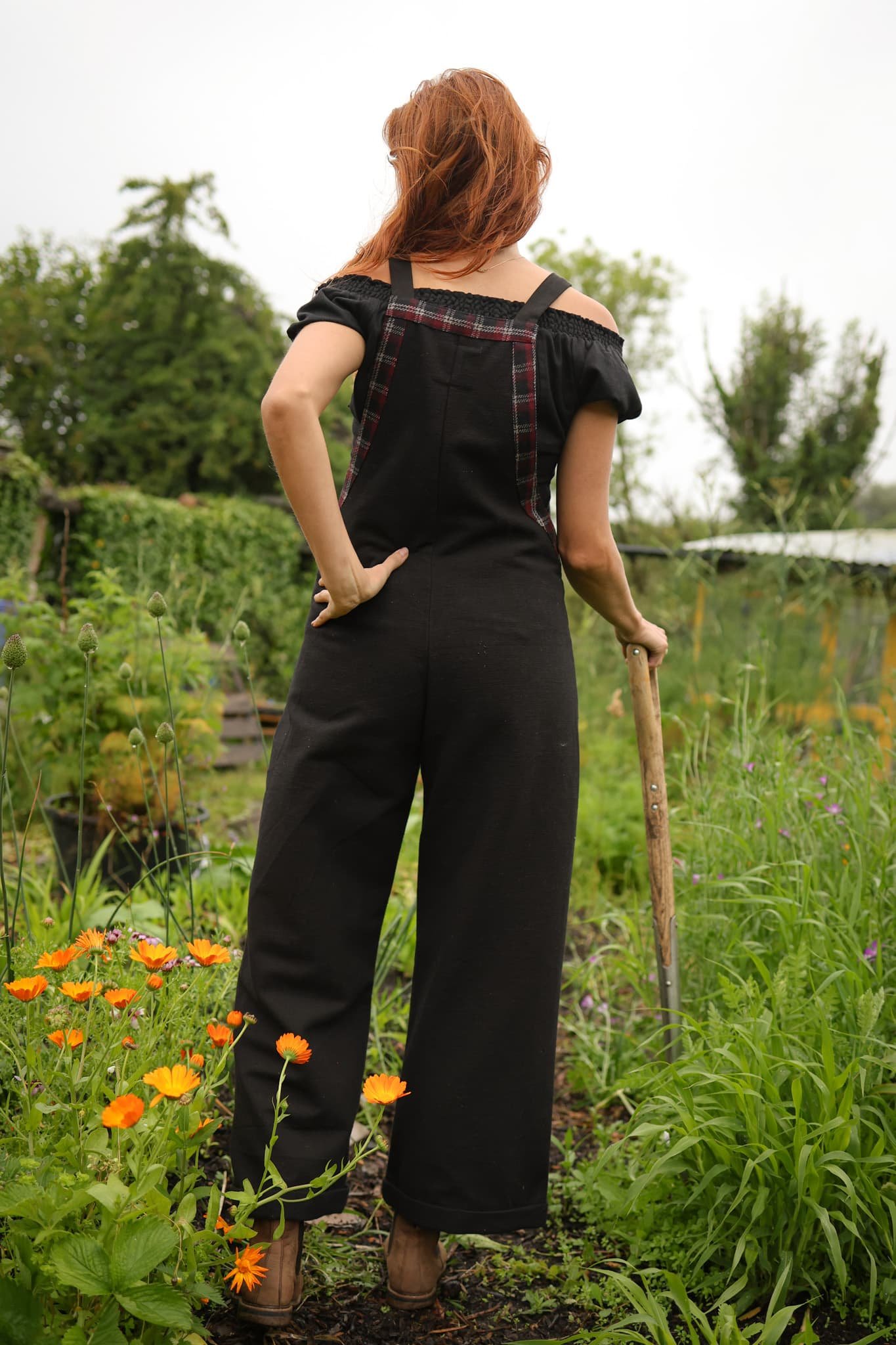 Embrace folklore fashion with our Meadow Black Dungarees, a breathable black jumpsuit made from natural cotton and detailed with tweed trims, the perfect cotton overalls for everyday layering