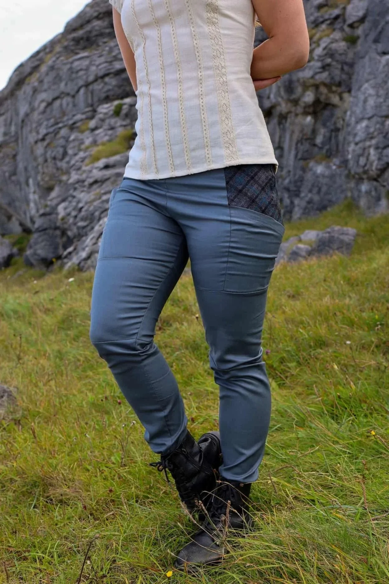 A model wears the Tara Linen Leggings, sustainable clothing linen blend trousers with tweed wool plaid pockets designed by Celtic Fusion.