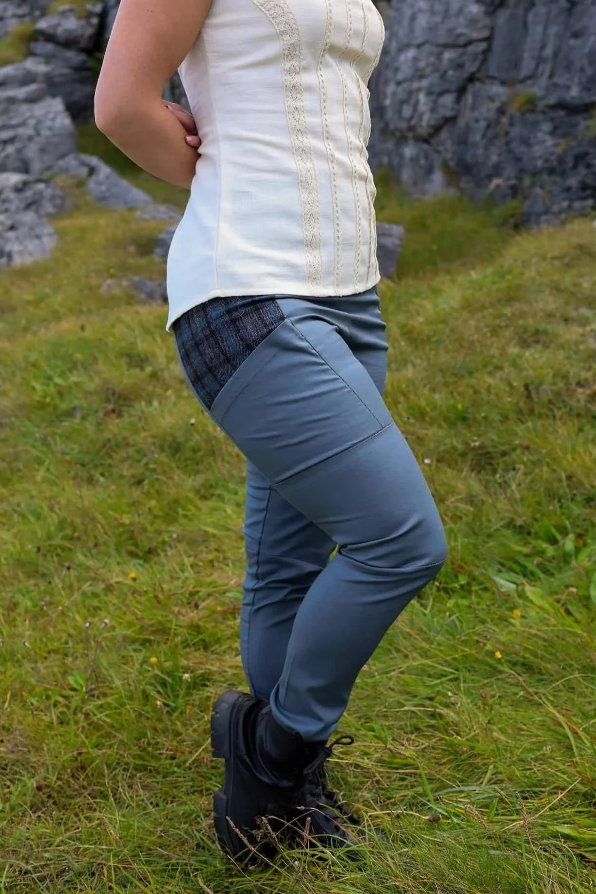 A model wears the Tara Linen Leggings, sustainable clothing linen blend trousers with tweed wool plaid pockets designed by Celtic Fusion.