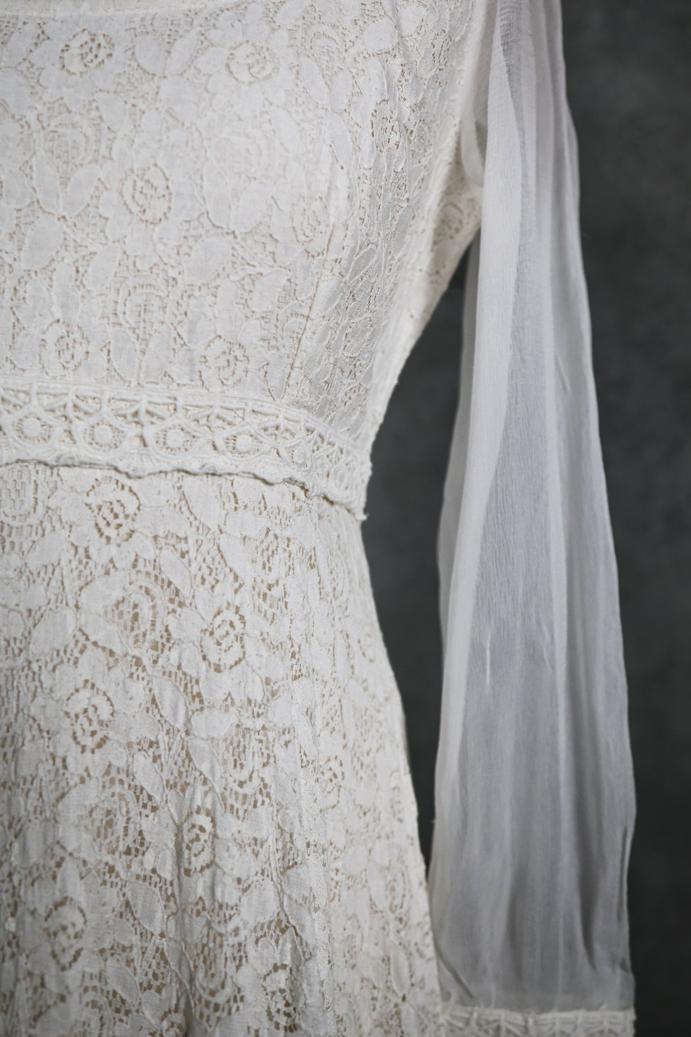 The Annagh Wedding Dress is an elegant cotton lace bridal gown with flowing bishop chiffon sleeves, a romantic low back, and ethical slow fashion values