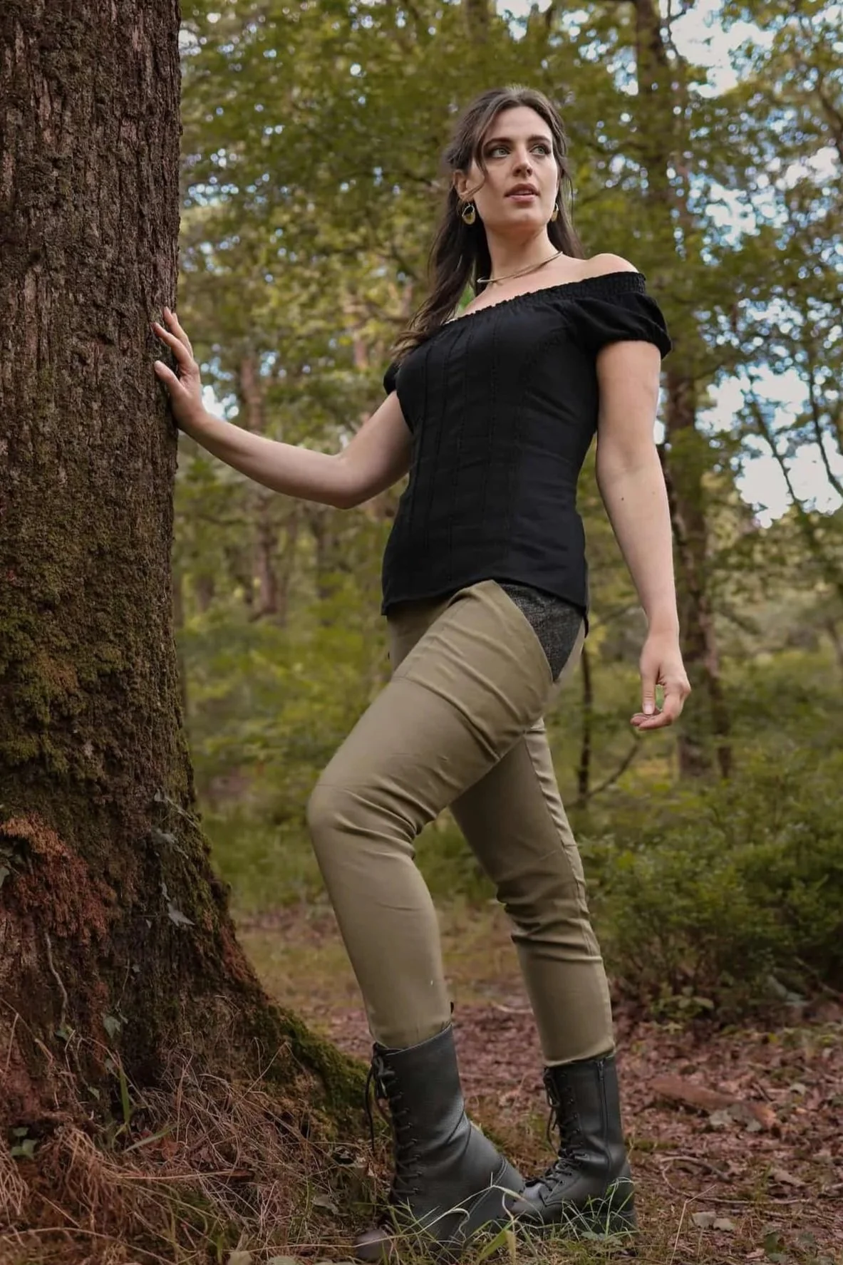 A model wears the Tara Linen Leggings, sustainable clothing linen blend trousers with tweed wool plaid pockets designed by Celtic Fusion.