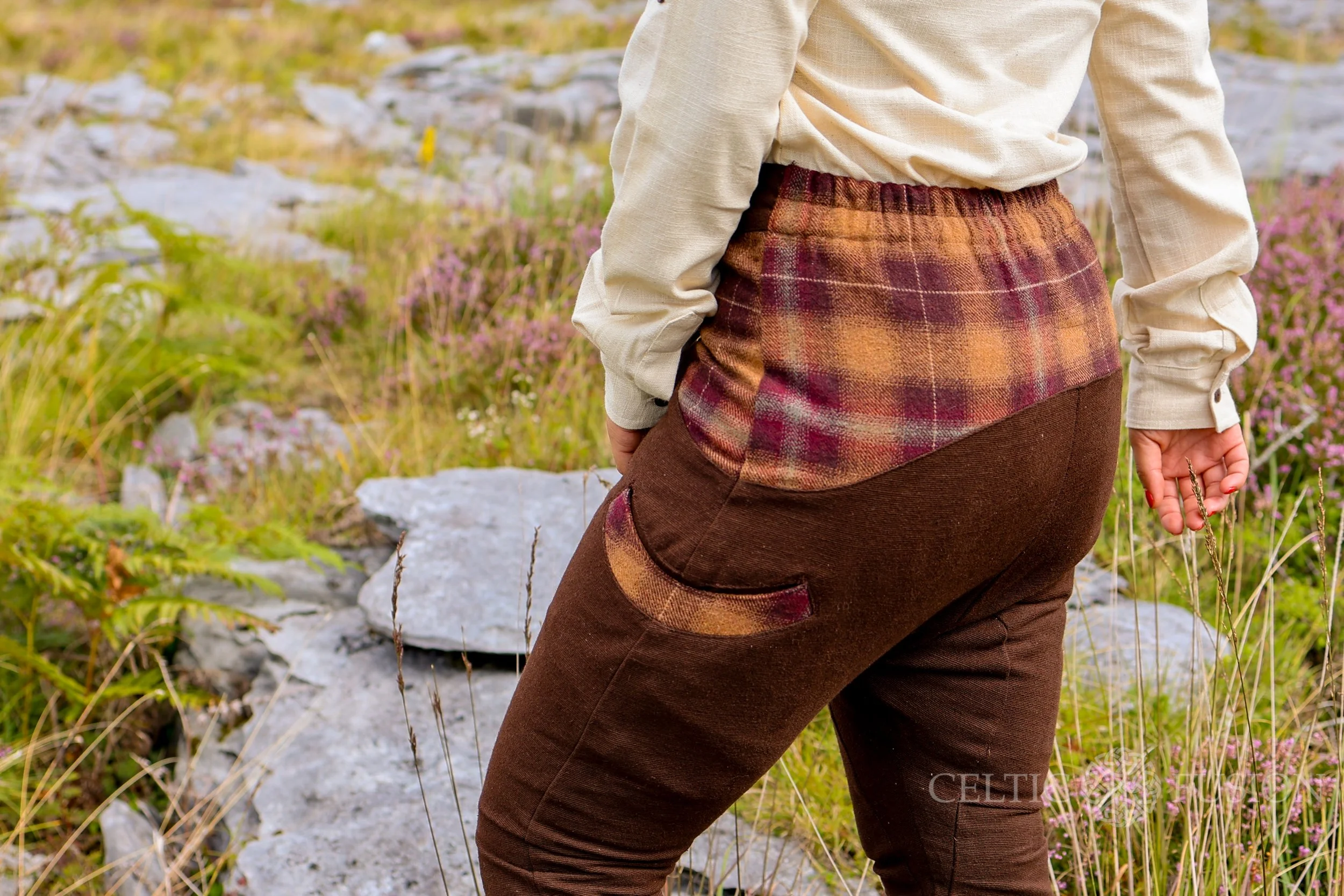 Upgrade your wardrobe with our brown low rise trousers, perfect as womens casual trousers. These low crotch trousers feature tweed accents, a tapered leg, and an elastic waistband for comfort.
