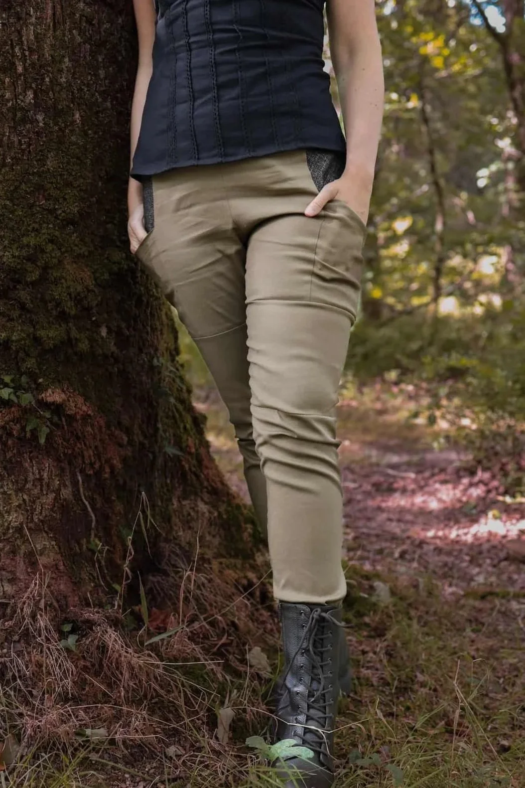 A model wears the Tara Linen Leggings, sustainable clothing linen blend trousers with tweed wool plaid pockets designed by Celtic Fusion.