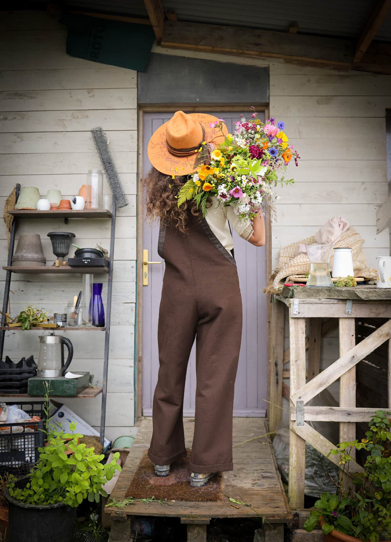 Discover our Meadow Brown Dungarees, an earthy brown jumpsuit trimmed with oak tweed, designed for folklore-inspired style, comfort, and everyday wear.