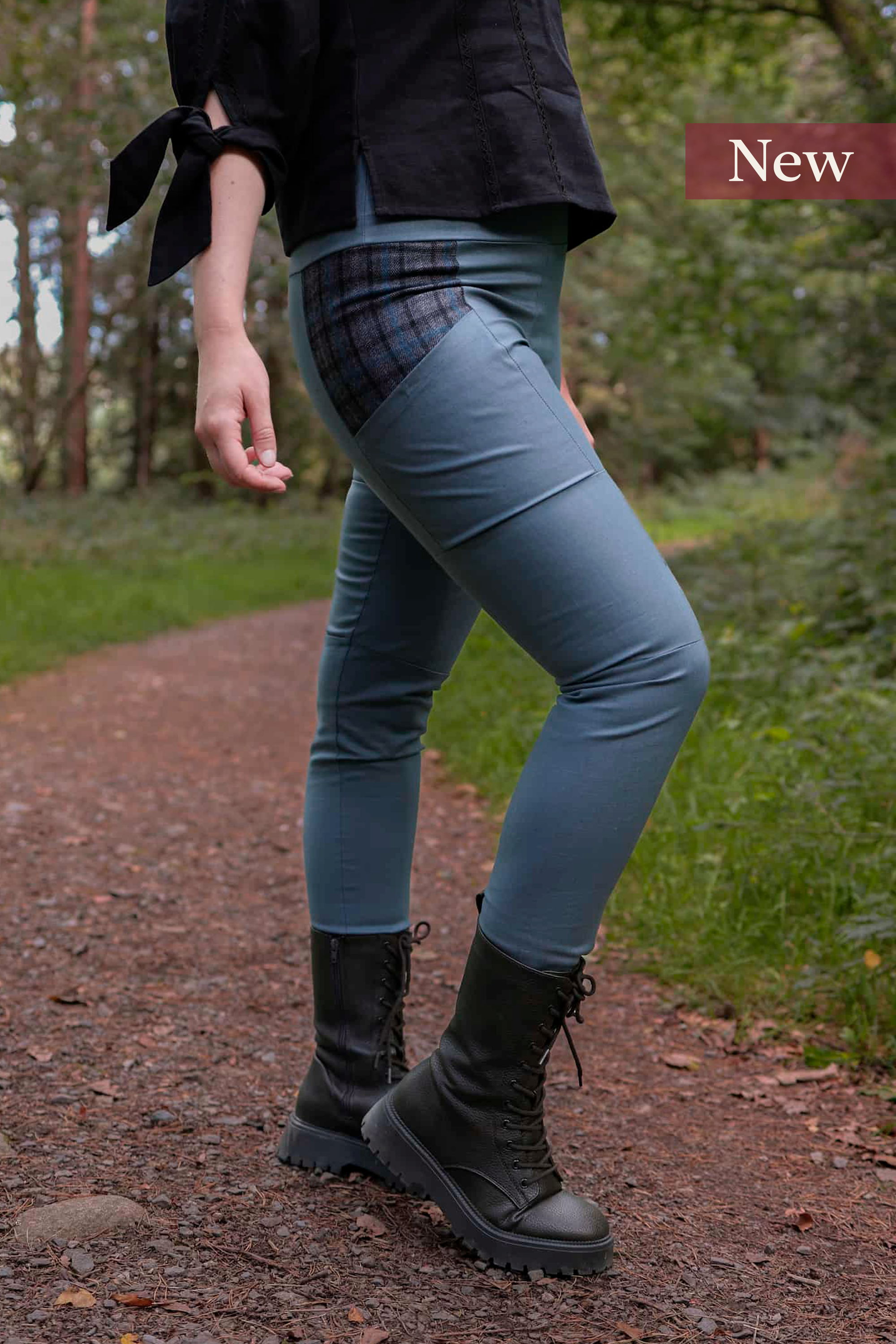 A model wears the Tara Linen Leggings, sustainable clothing linen blend trousers with tweed wool plaid pockets designed by Celtic Fusion.