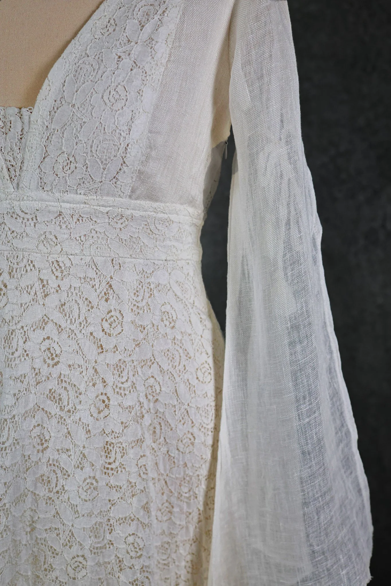 Ava Wedding Dress, An Irish-designed lace gown with flowing linen net sleeves and tie details, perfect for folklore-inspired and sustainable bridal style.