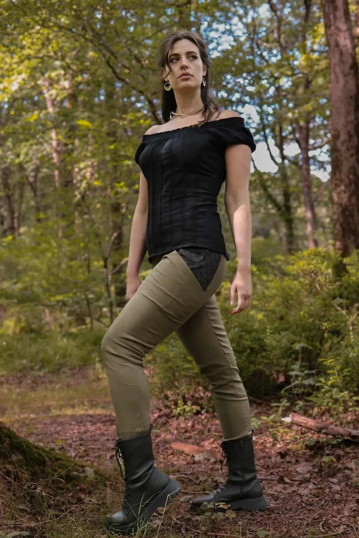 A model wears the Tara Linen Leggings, sustainable clothing linen blend trousers with tweed wool plaid pockets designed by Celtic Fusion.