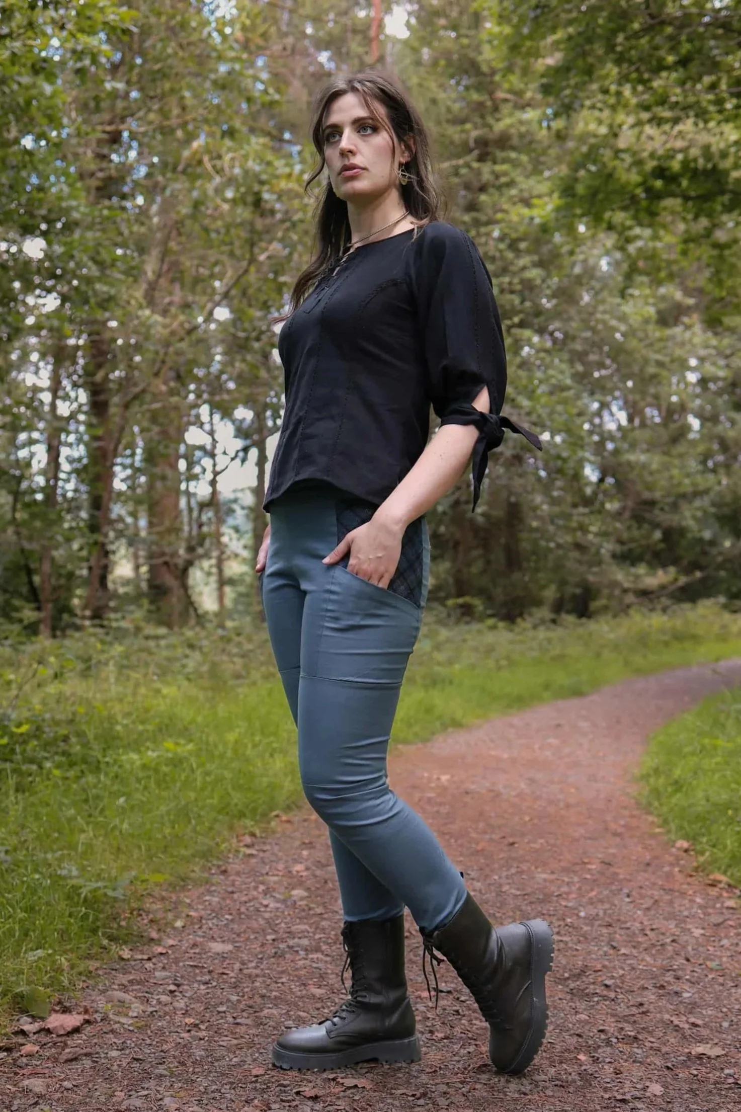 A model wears the Tara Linen Leggings, sustainable clothing linen blend trousers with tweed wool plaid pockets designed by Celtic Fusion.