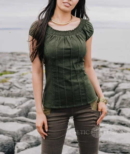 A romantic corset top inspired by folklore style, featuring puffed sleeves, cotton lace detailing, and a flattering corset tie back.