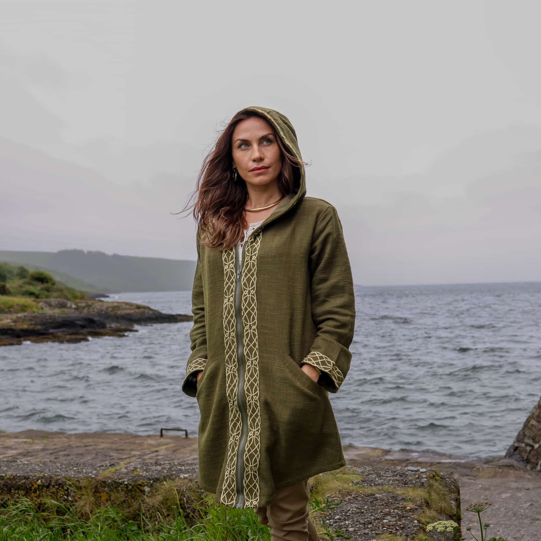 Discover a stylish Celtic jacket featuring Celtic knotwork embroidery, crafted from 100% heavy cotton slub with an Irish design, deep hood, pockets, and zipper closure.