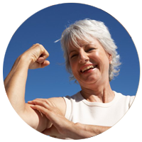 Older woman with strong arms and bones. Jala Flow Yoga in Sidmouth can strengthen bones, preventing or delaying osteoporosis.