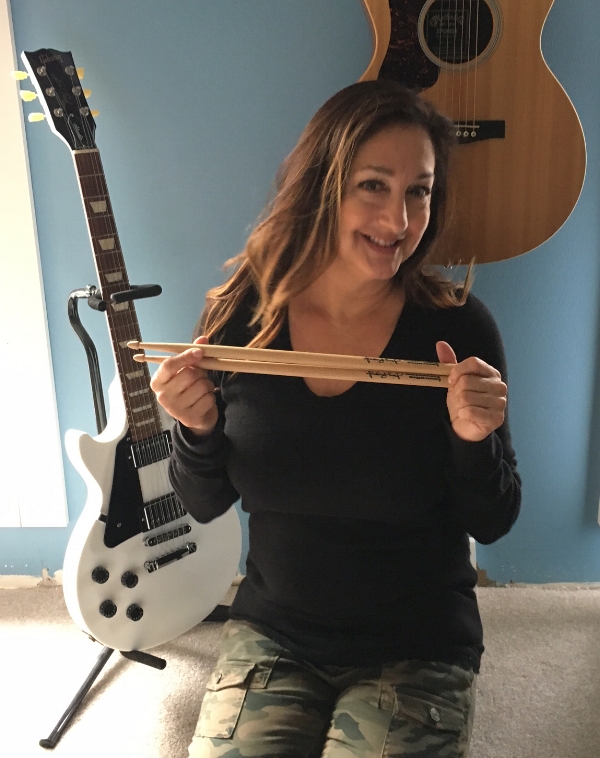 Michaela received these drumsticks from Martie during a DCX show!