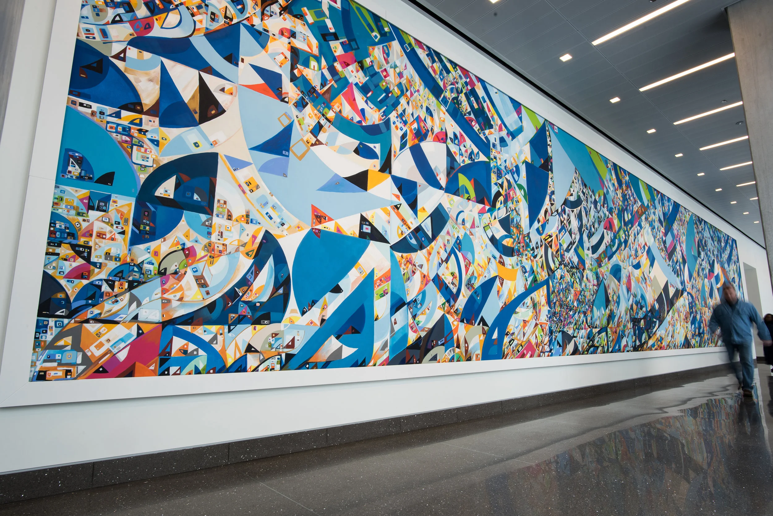 Site-specific mural integrated into university interior architecture