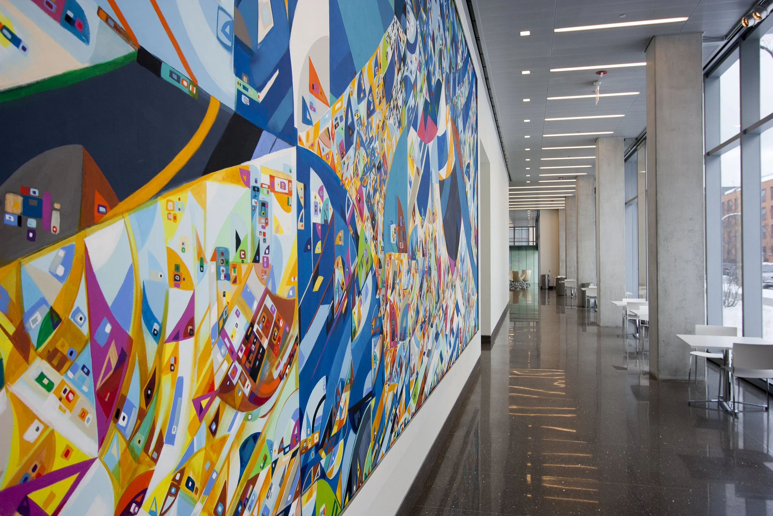 Site-specific mural integrated into university interior architecture