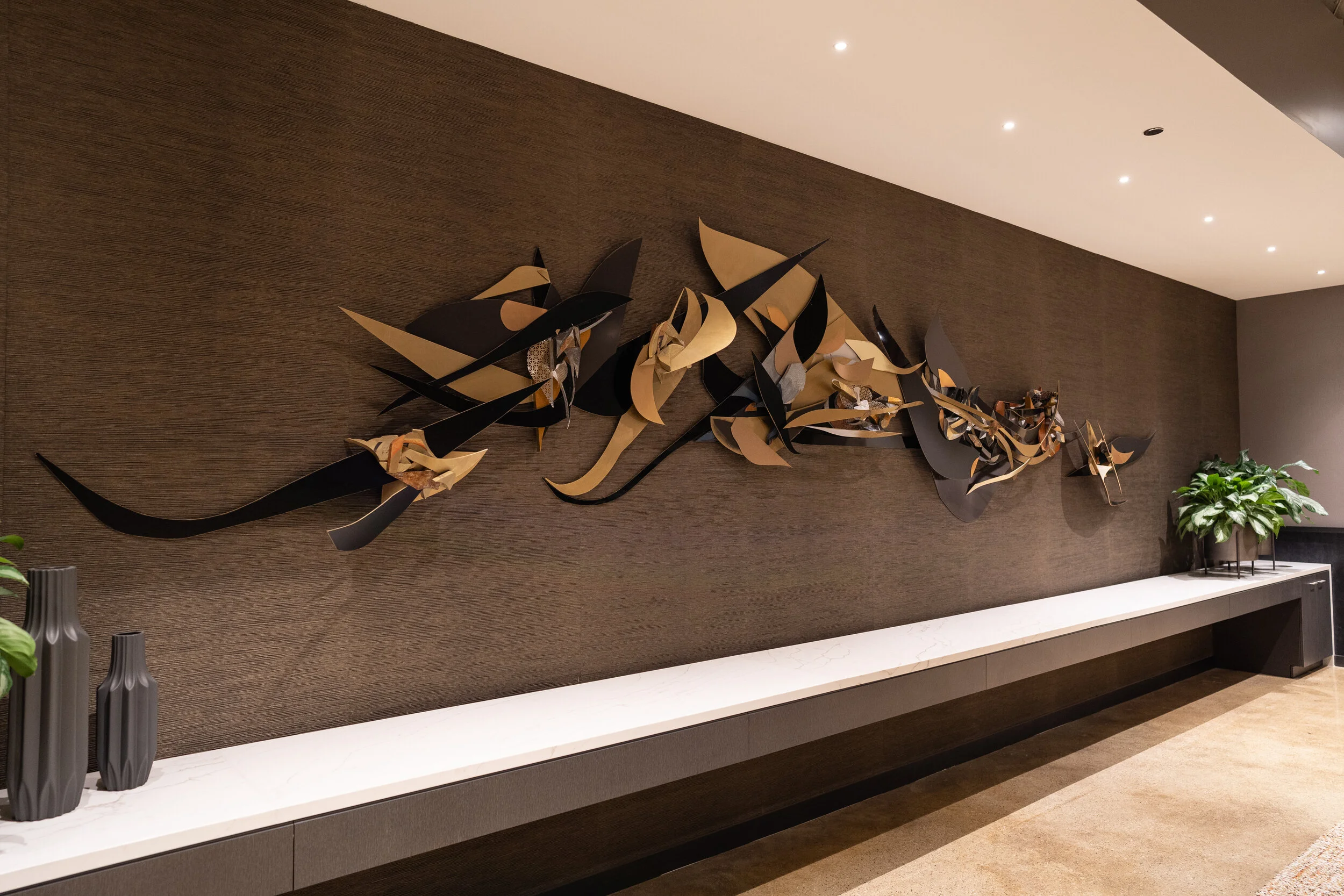 Hand-fabricated sculptural artwork installed within a civic building