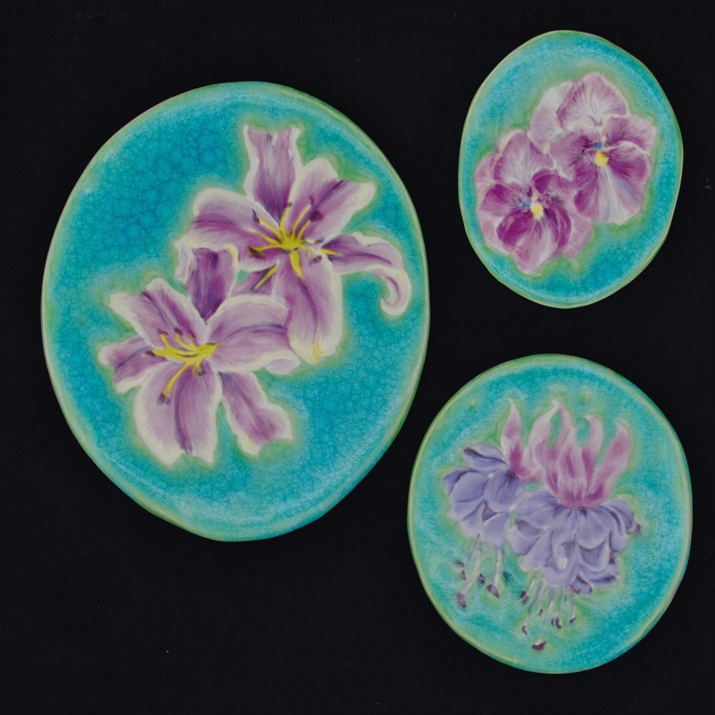  Clockwise from left:  1) Stargazer Lillies - 9” tall oval tile ($75)  2) Pansies - 5.25” tall oval tile ($25)  3) Freesias - 6.25” tall oval tile ($50) 
